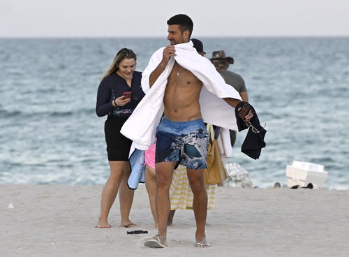 EXCLUSIVE: Novak Djokovic is seen swimming and running on Miami Beach after withdrawing from the Miami Open following his shock defeat at Indian Wells.