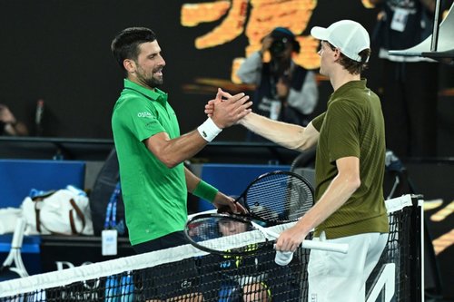 epa12692813 Jannik Sinner of Italy (R) congratulates Novak Djokovic of Serbia
