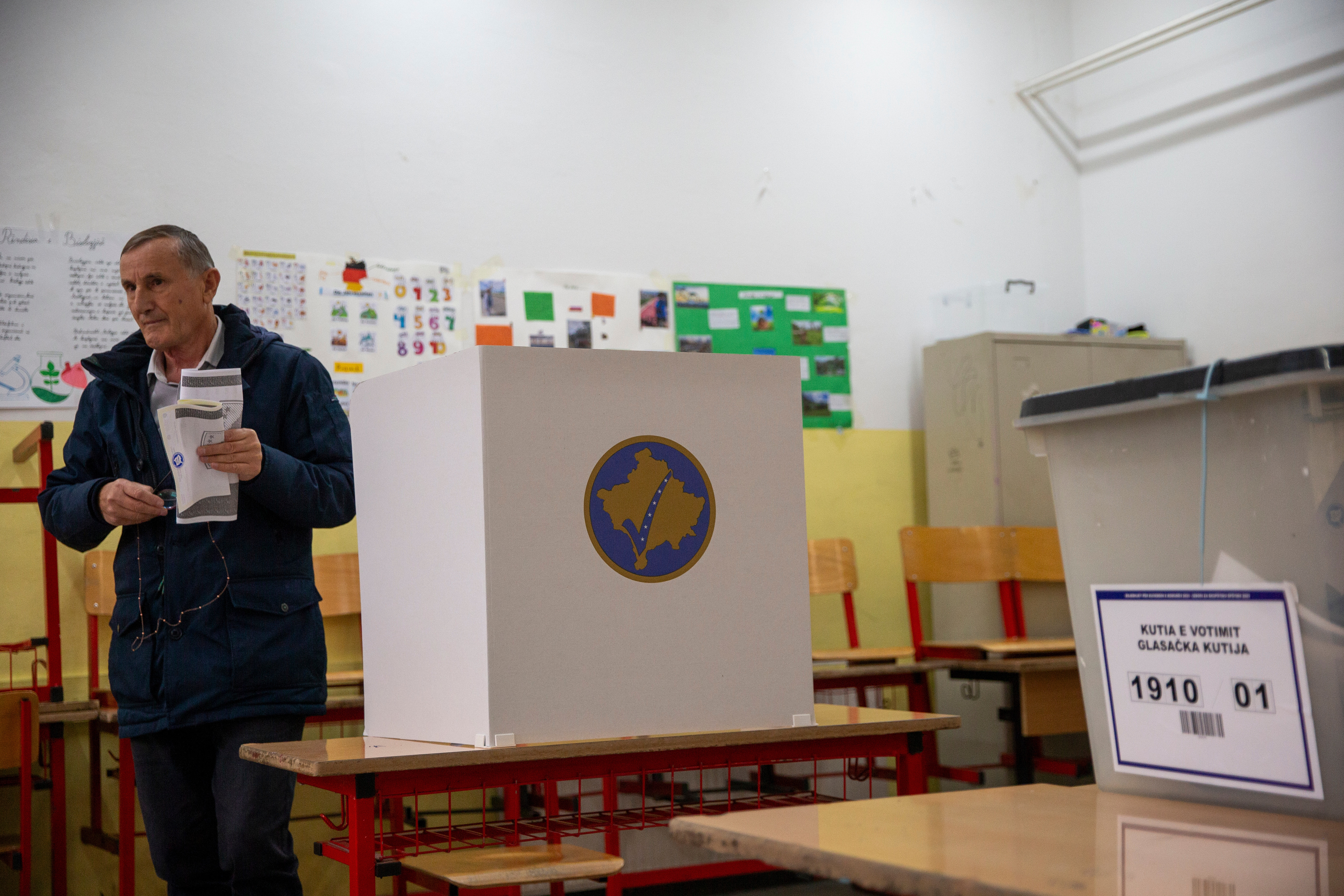 People vote for the municipal elections in Pristina, Kosovo on Sunday, Oct. 12, 2025. (AP Photo/Visar Kryeziu)