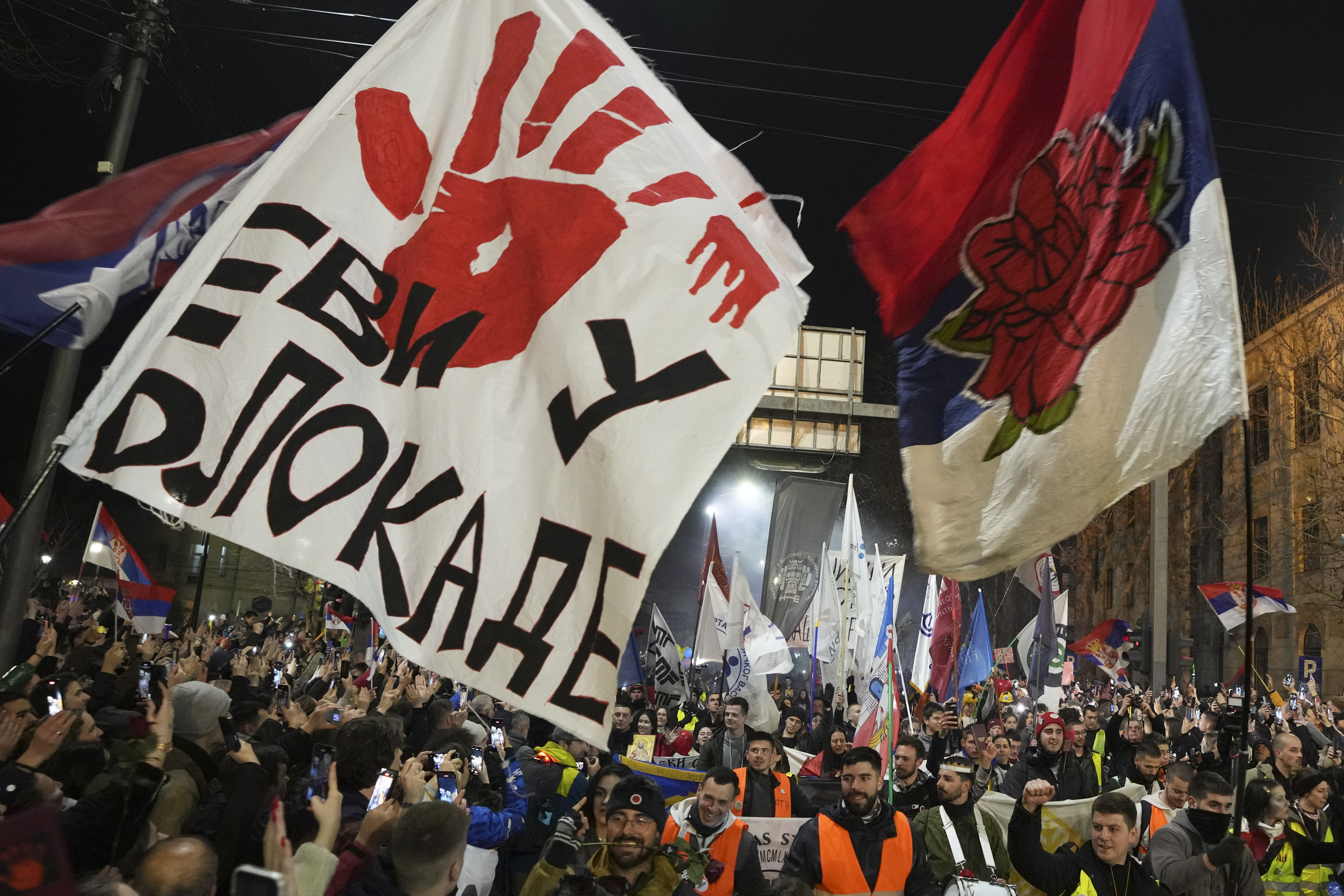 People welcome students who have arrived to protest the deaths of 15 people killed in the November collapse of a train station canopy in the town of Nis, Serbia, Friday, Feb. 28, 2025. (AP Photo/Darko Vojinovic)