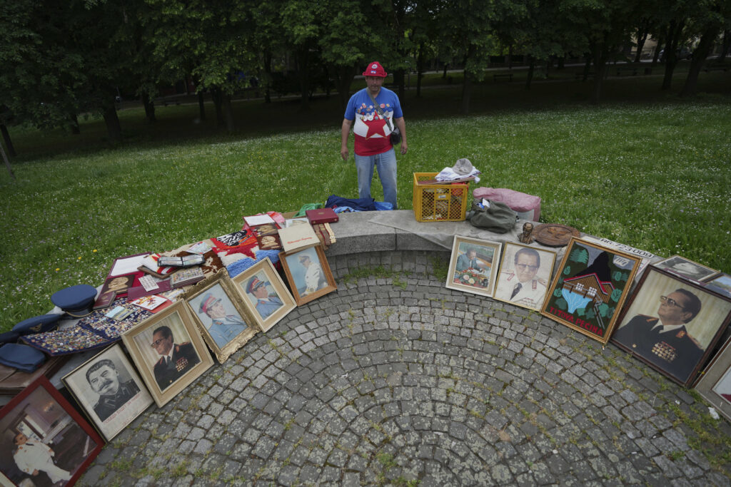 A street vendor sells pictures of the late Yugoslav communist president Josip Broz Tito in front of Tito's memorial complex prior to a ceremony marking the 45th anniversary of his death in Belgrade, Serbia, Sunday, May 4, 2025. (AP Photo/Darko Vojinovic)