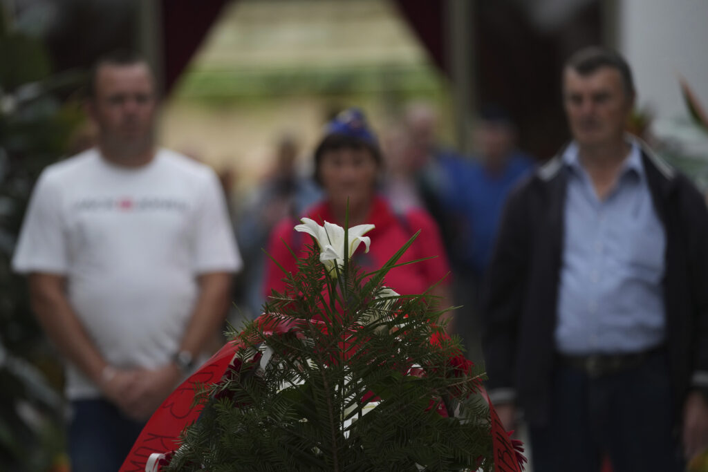 Supporters of the late Yugoslav communist president Josip Broz Tito lay flowers on his tomb during a ceremony marking the 45th anniversary of his death in Belgrade, Serbia, Sunday, May 4, 2025. (AP Photo/Darko Vojinovic)