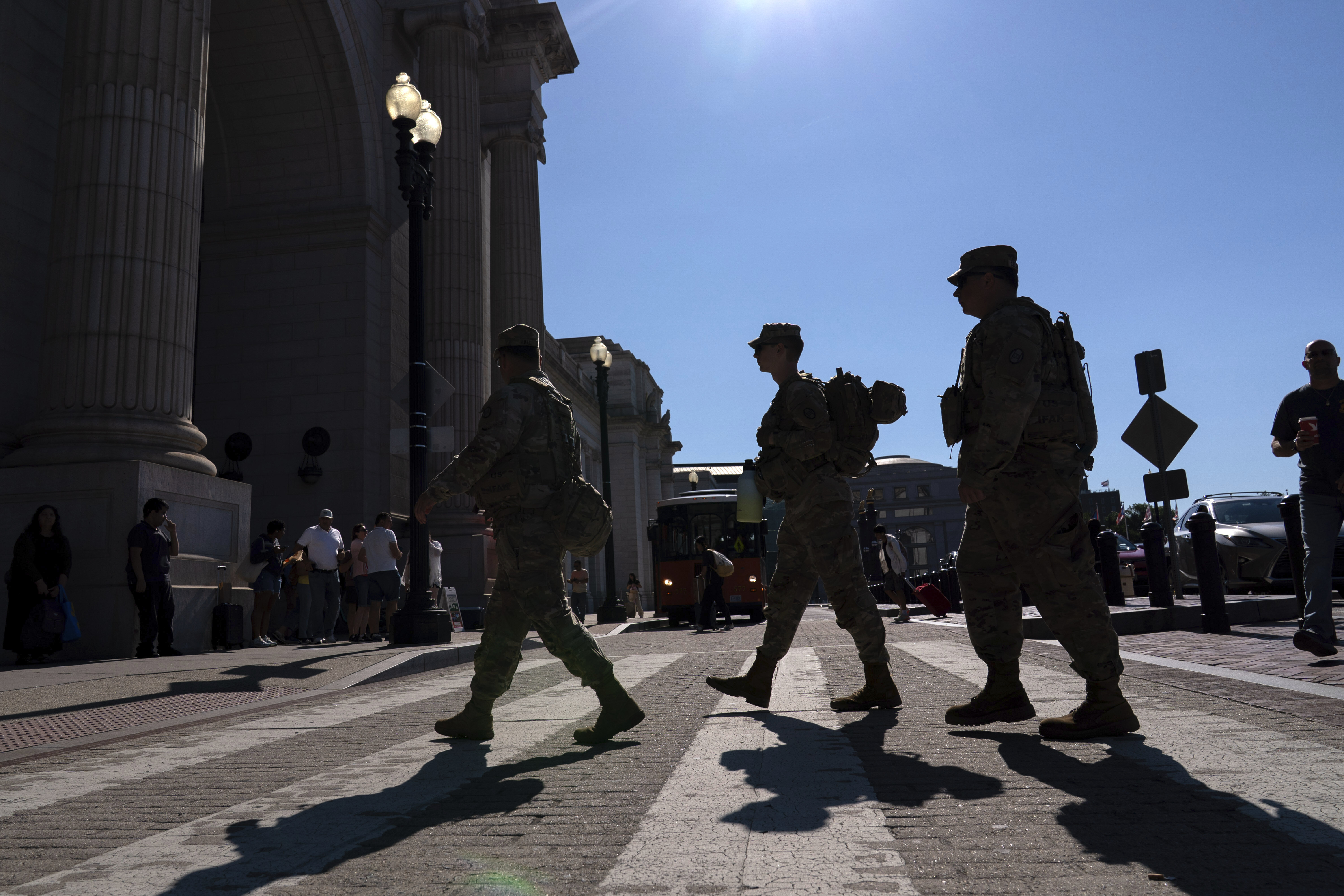 Members of the District of Columbia National Guard patrol the train passenger area in Union Station, Saturday, Aug. 23, 2025, in Washington. (AP Photo/Jose Luis Magana)