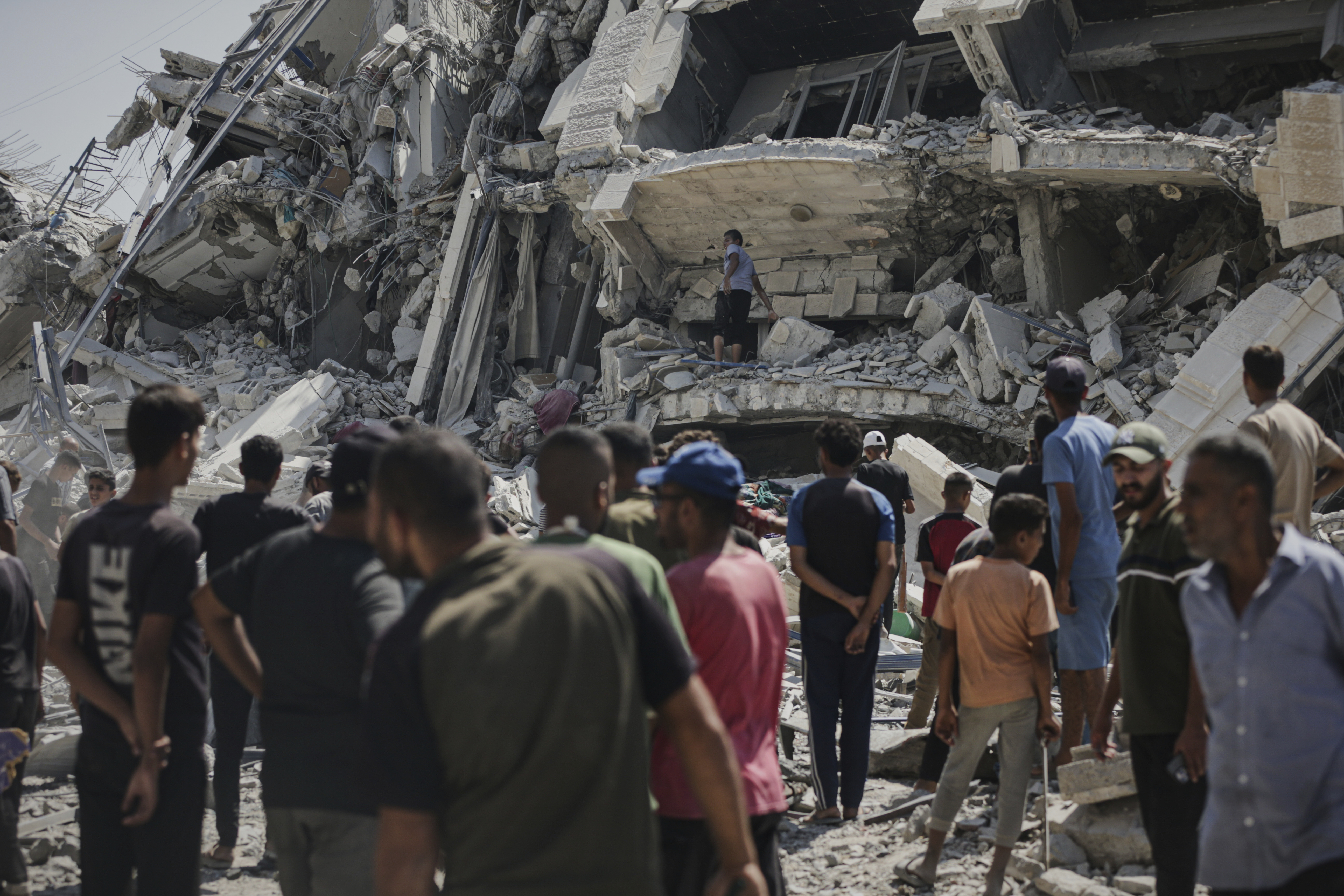 Palestinians inspect the damage after an Israeli army airstrike on a high-rise building in Gaza City, Friday, Sept. 5, 2025, after the Israeli army issued a prior warning. (AP Photo/Yousef Al Zanoon)