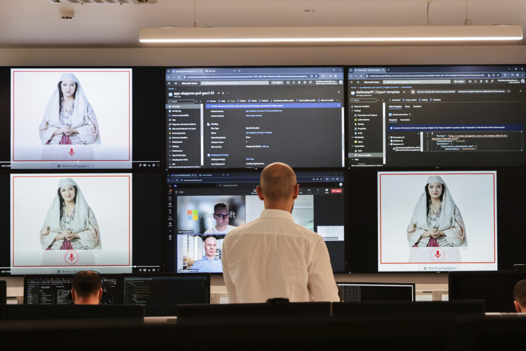 Albanian experts work at the National Agency for Information Society as an artificial intelligence "minister" Diella, whose name means "Sun" in Albanian, is seen on the screens in Tirana, Albania, Friday, Sept. 12, 2025. (AP Photo/Vlasov Sulaj)