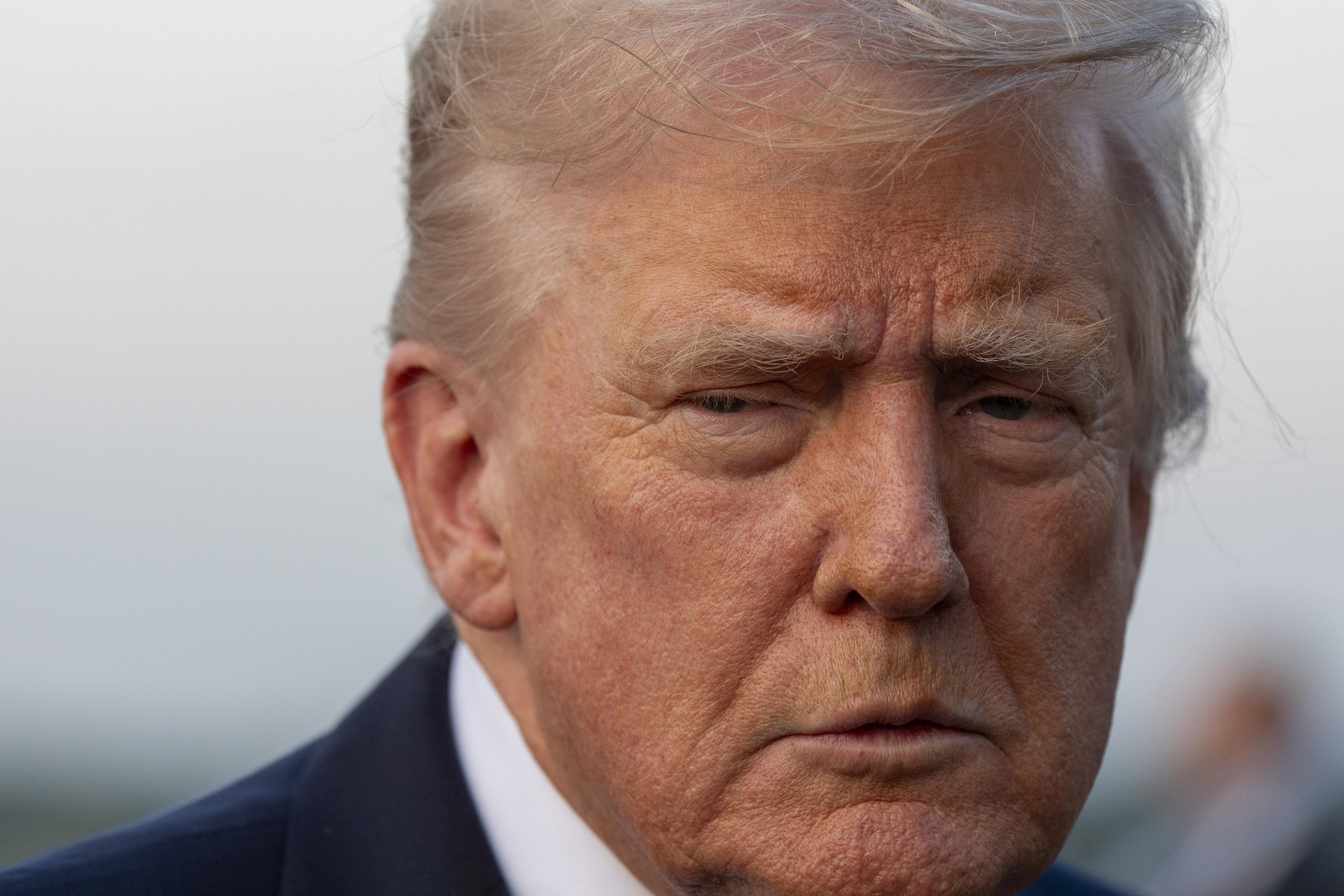 President Donald Trump speaks with reporters before he departs on Air Force One at Morristown Airport, Sunday, Sept. 14, 2025, in Morristown, N.J. (AP Photo/Alex Brandon)