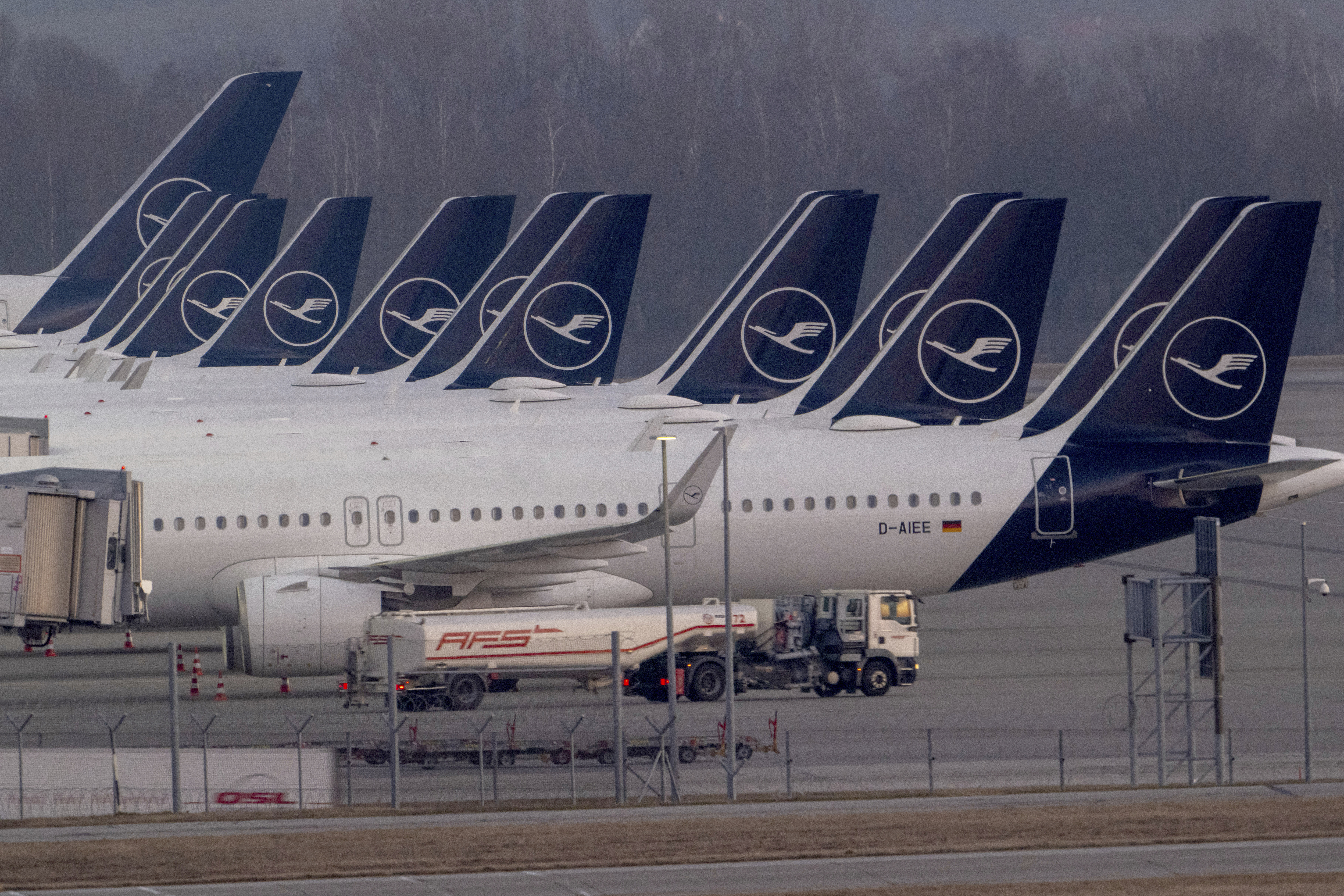 Lufthansa aircraft sit at Terminal 2 at Munich Airport, Germany Monday morning, March 10, 2025. (Peter Kneffel/dpa via AP)