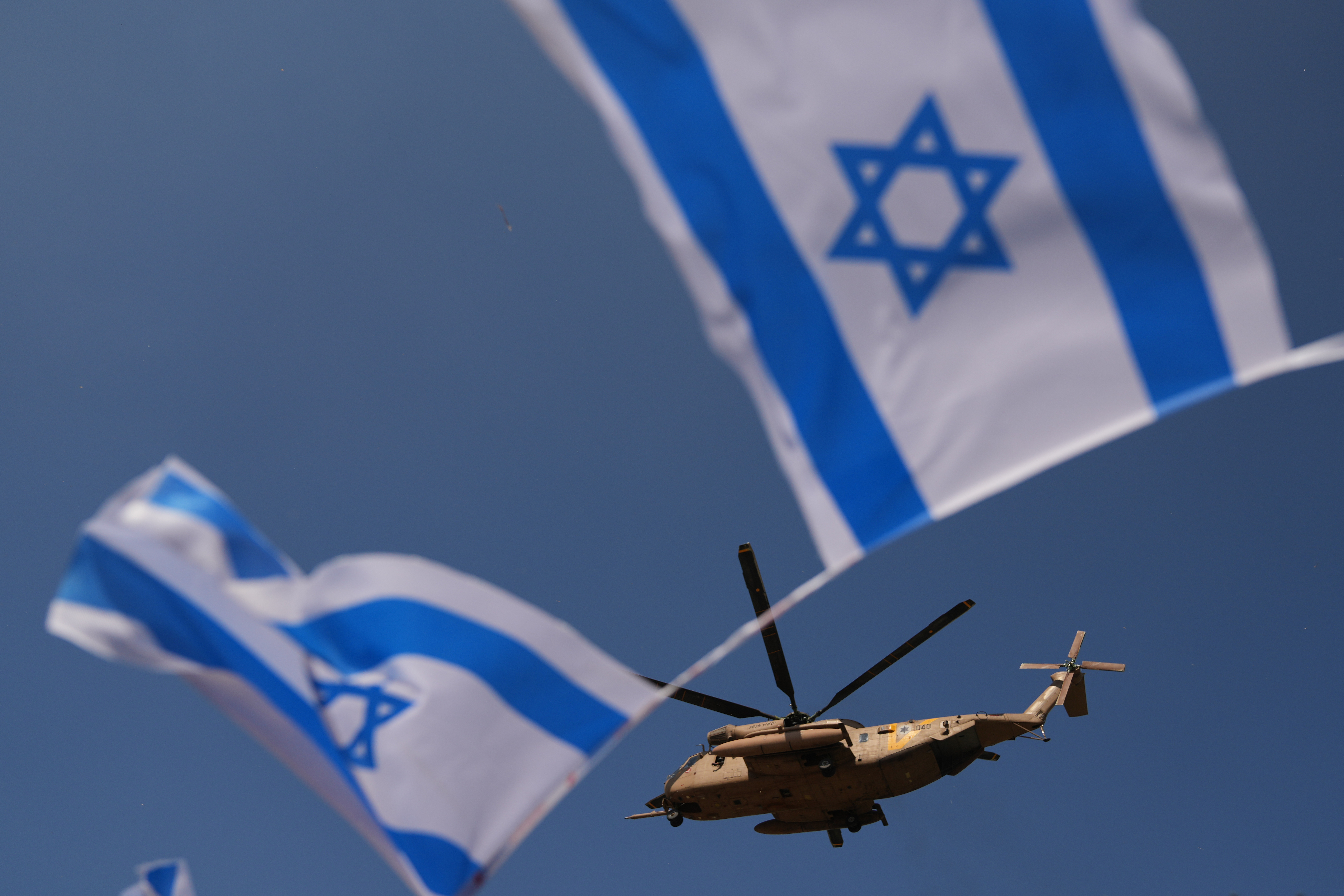 A military helicopter takes off from Beilinson Hospital in Petah Tikva, Israel, after transporting hostages released from Hamas captivity in the Gaza Strip, Monday, Oct. 13, 2025. (AP Photo/Francisco Seco)