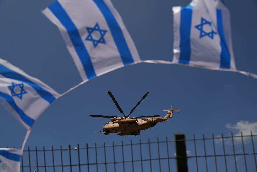 A military helicopter takes off from Beilinson Hospital in Petah Tikva, Israel, after transporting hostages released from Hamas captivity in the Gaza Strip, Monday, Oct. 13, 2025. (AP Photo/Francisco Seco)