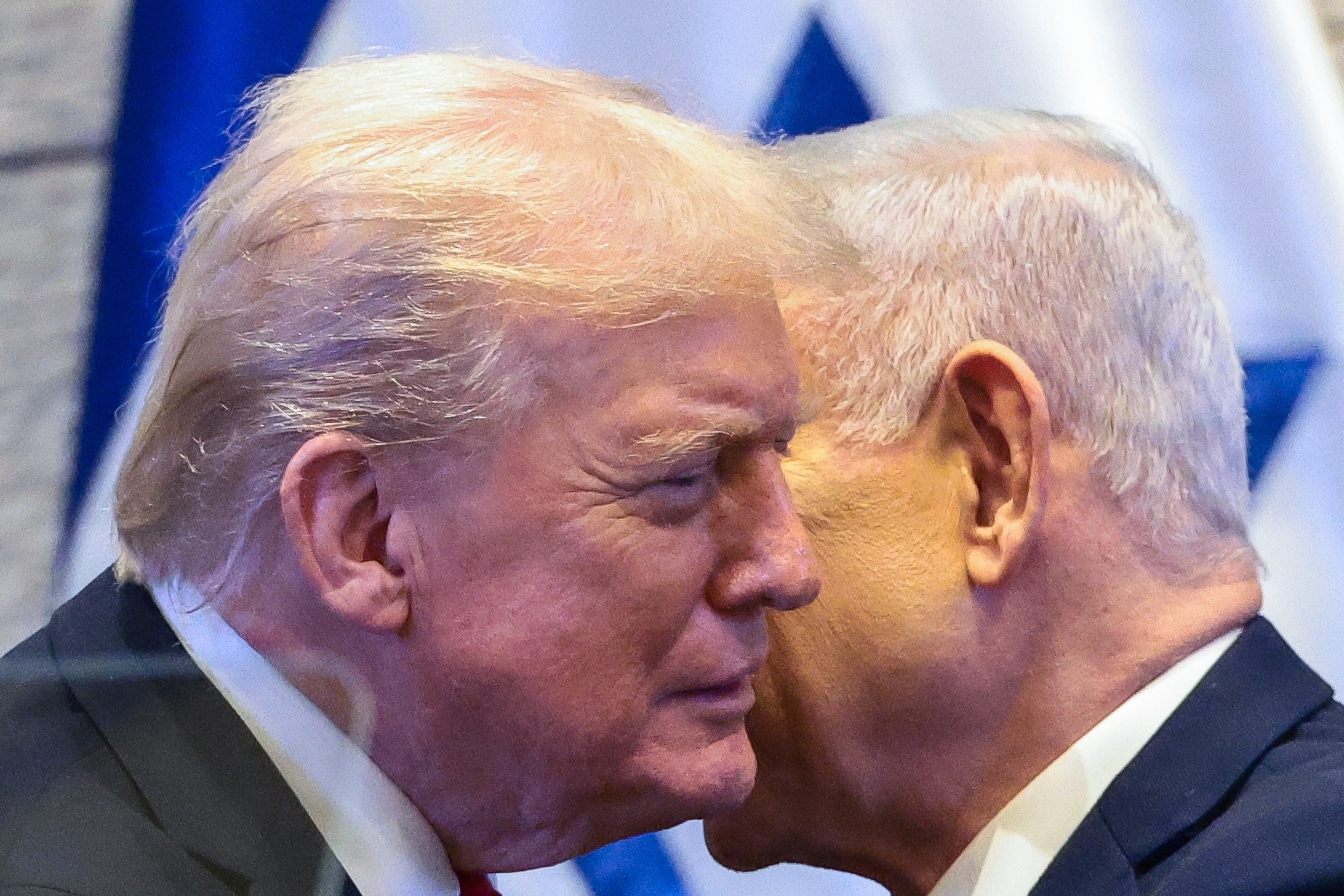 President Donald Trump talks with Israel's Prime Minister Benjamin Netanyahu at the Knesset, Israel's parliament, Monday, Oct. 13, 2025, in Jerusalem.  (Evelyn Hockstein/Pool via AP)
