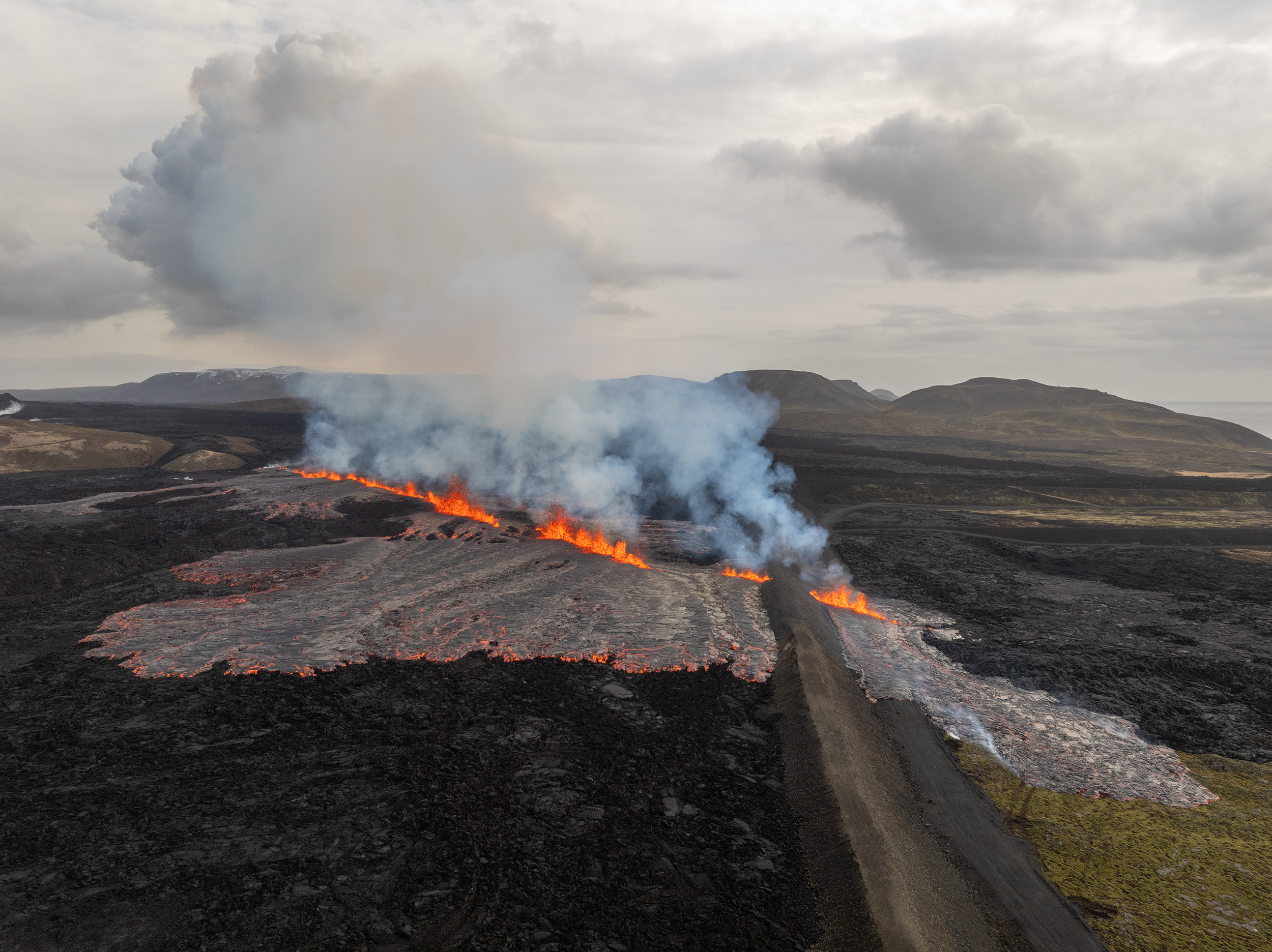 An areal view of the volcanic eruption near the town of Grindavik, on the Reykjanes Peninsula, Iceland, Tuesday, April 1, 2025. (AP Photo/Marco di Marco)