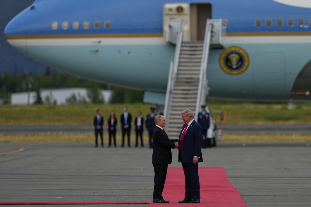 President Donald Trump greets Russia's President Vladimir Putin Friday, Aug. 15, 2025, at Joint Base Elmendorf-Richardson, Alaska. (AP Photo/Julia Demaree Nikhinson)