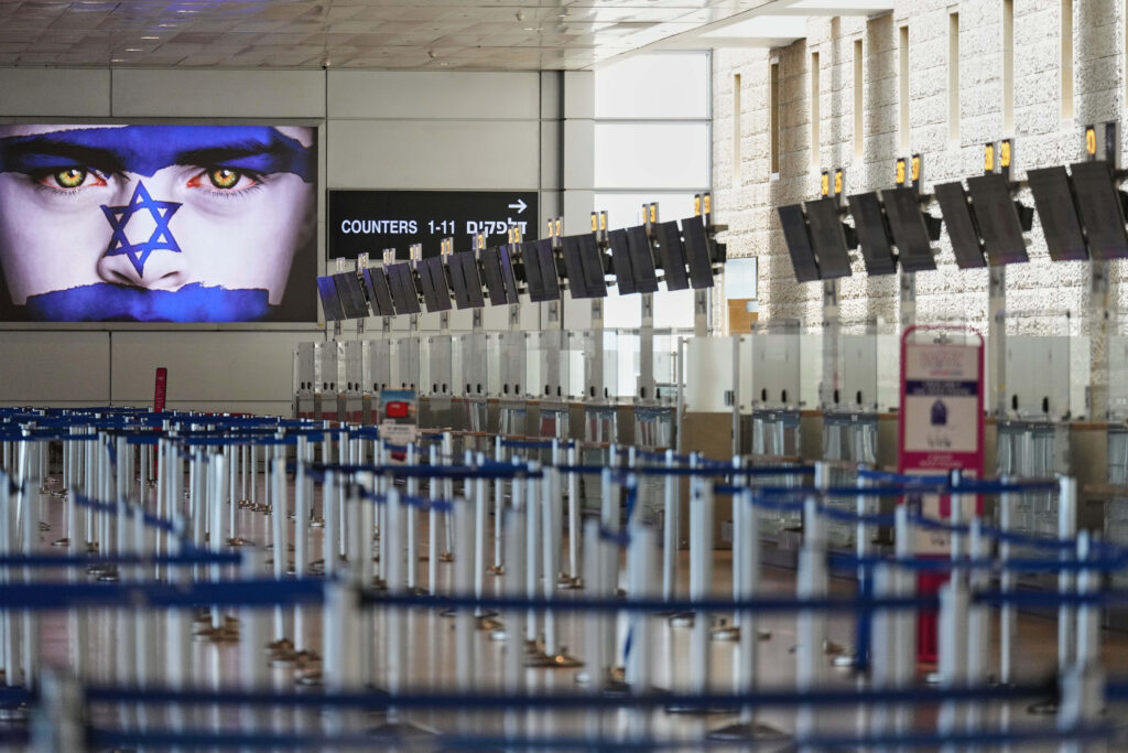 Israel's Ben Gurion Airport is empty of passengers following an Israeli military strike on Iran, near Tel Aviv, Israel, Friday, June 13, 2025. (AP Photo/Ariel Schalit)