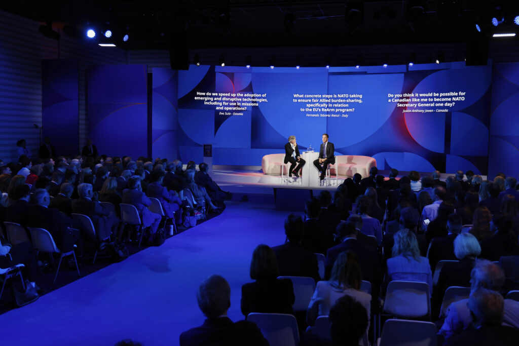 NATO Secretary General Mark Rutte, center right, addresses the audience at the NATO public forum on the sidelines of the NATO summit in The Hague, Netherlands, Tuesday, June 24, 2025. (AP Photo/Geert Vanden Wijngaert)