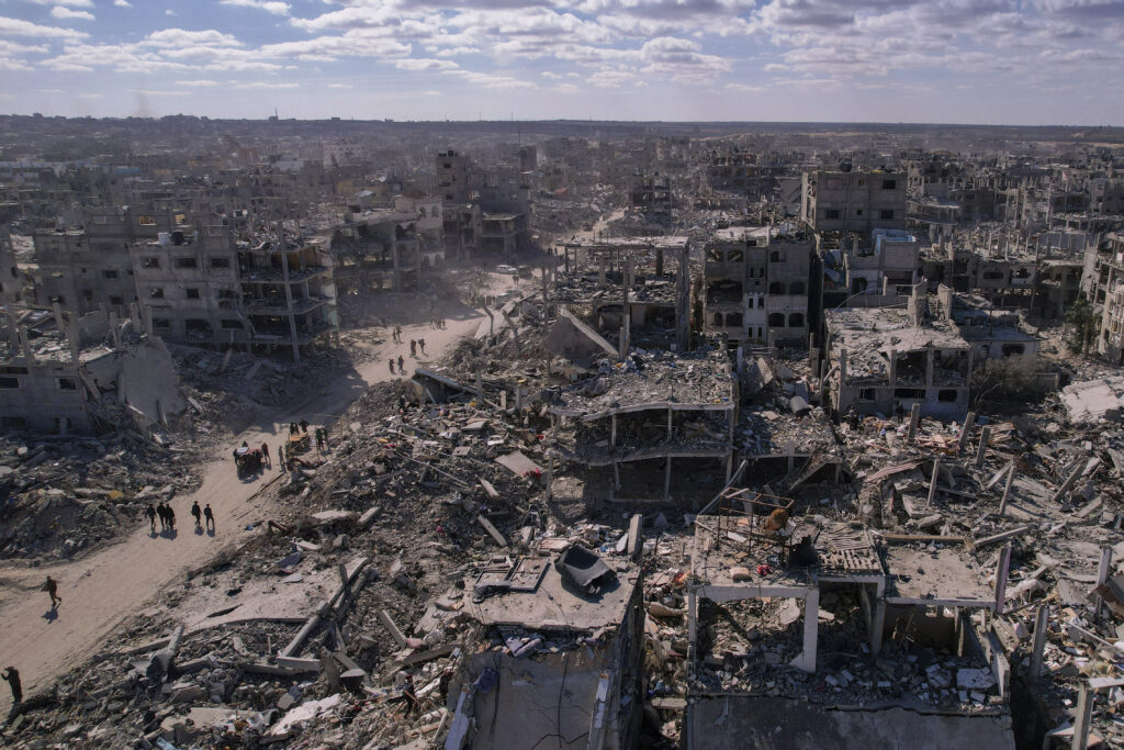 An aerial photograph taken by a drone shows displaced Palestinians returning to Rafah, a day after the ceasefire deal between Israel and Hamas came into effect, Gaza Strip, Monday, Jan. 20, 2025. (AP Photo/Mohammad Abu Samra)