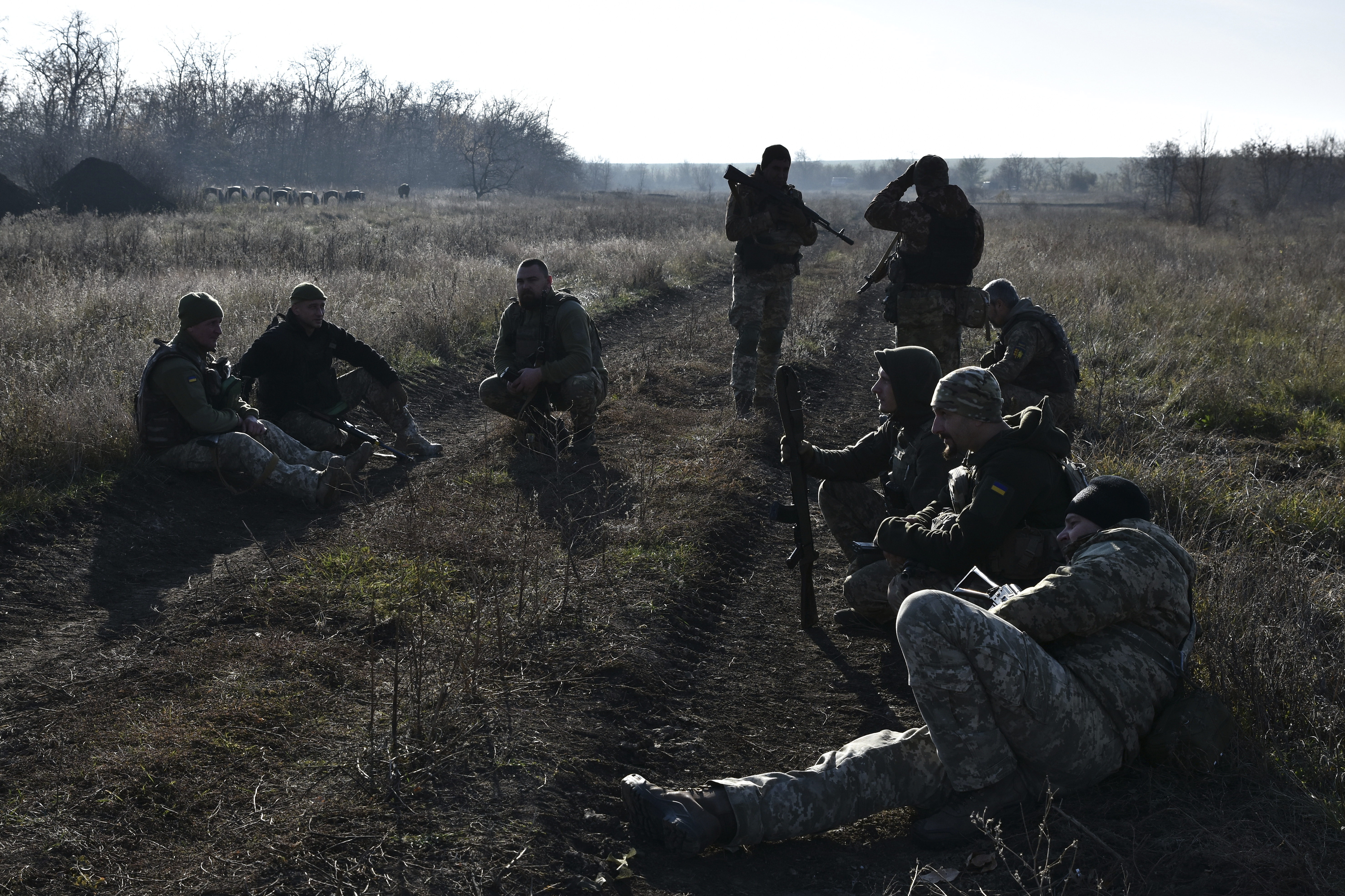 In this photo provided by the Ukraine's 65th Mechanised Brigade press service on Nov. 19, 2024, Ukrainian soldiers rest during a training at a polygon in Zaporizhzhia region, Ukraine. (Andriy Andriyenko/Ukraine's 65th Mechanised Brigade via AP)