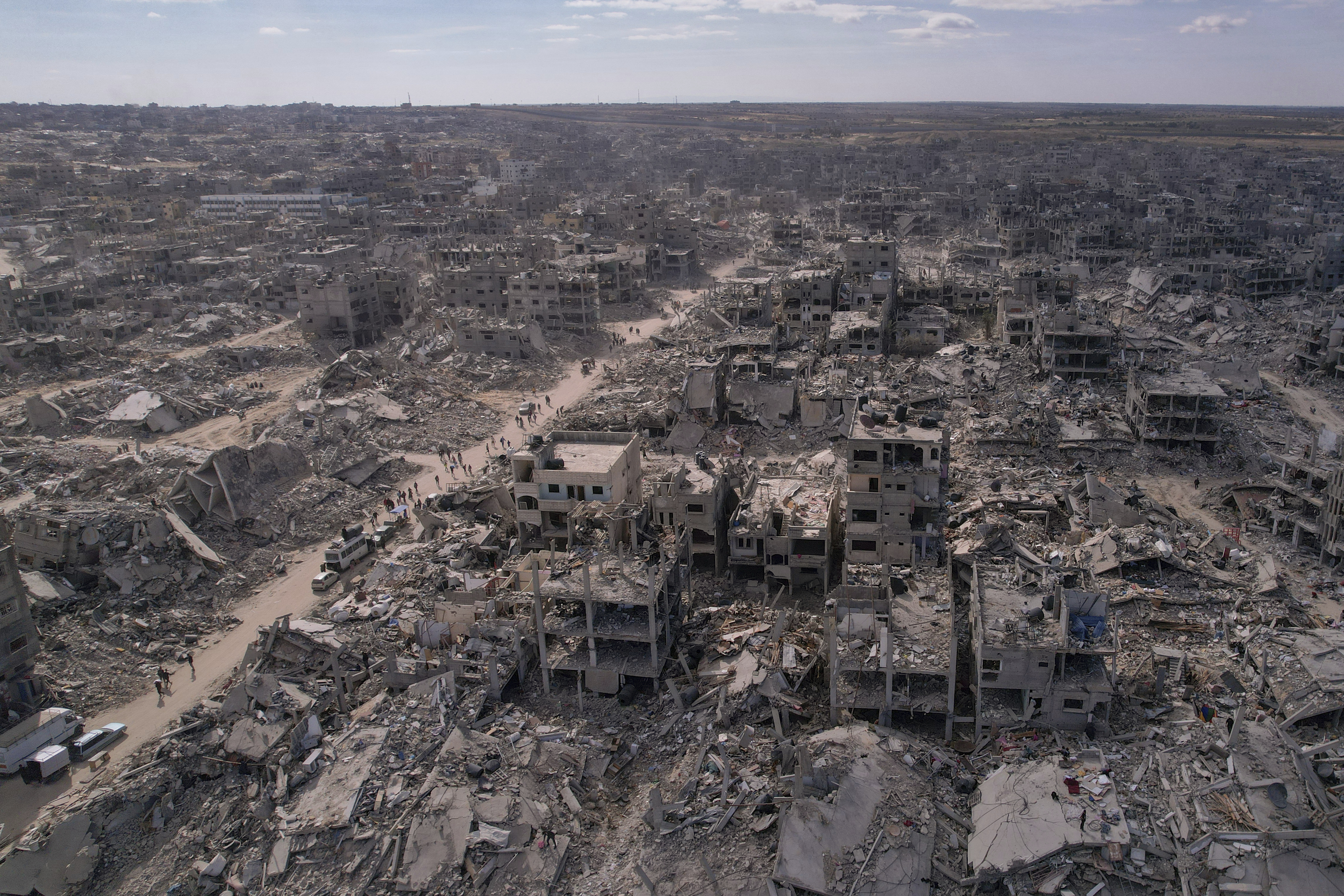An aerial photograph taken by a drone shows displaced Palestinians returning to Rafah, a day after the ceasefire deal between Israel and Hamas came into effect, Gaza Strip, Monday, Jan. 20, 2025. (AP Photo/Mohammad Abu Samra)
