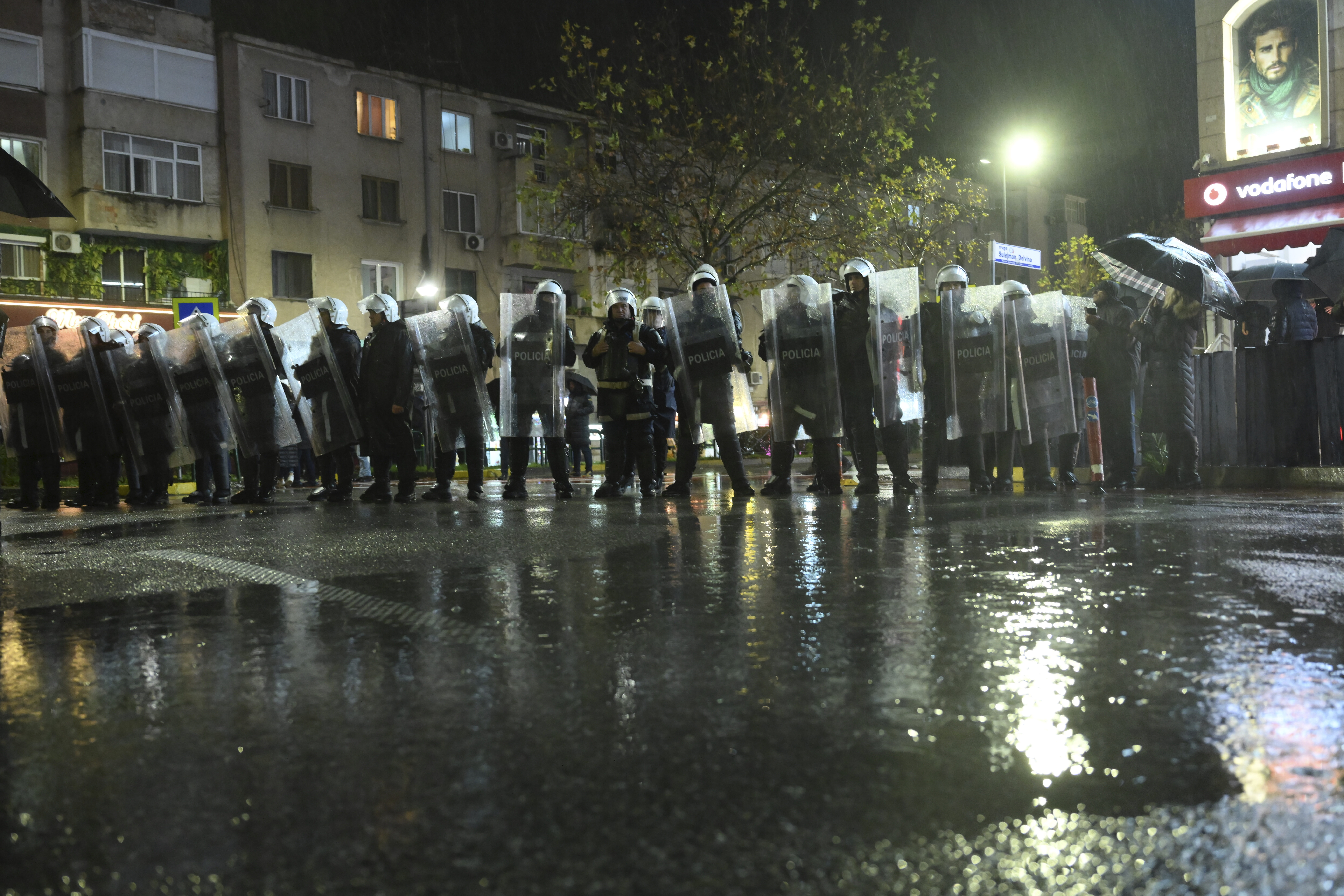 Police block opposition protesters during an anti-government rally asking for a technocratic caretaker Cabinet, in Tirana, Albania, Monday, Dec. 23, 2024. (AP Photo/Vlasov Sulaj)