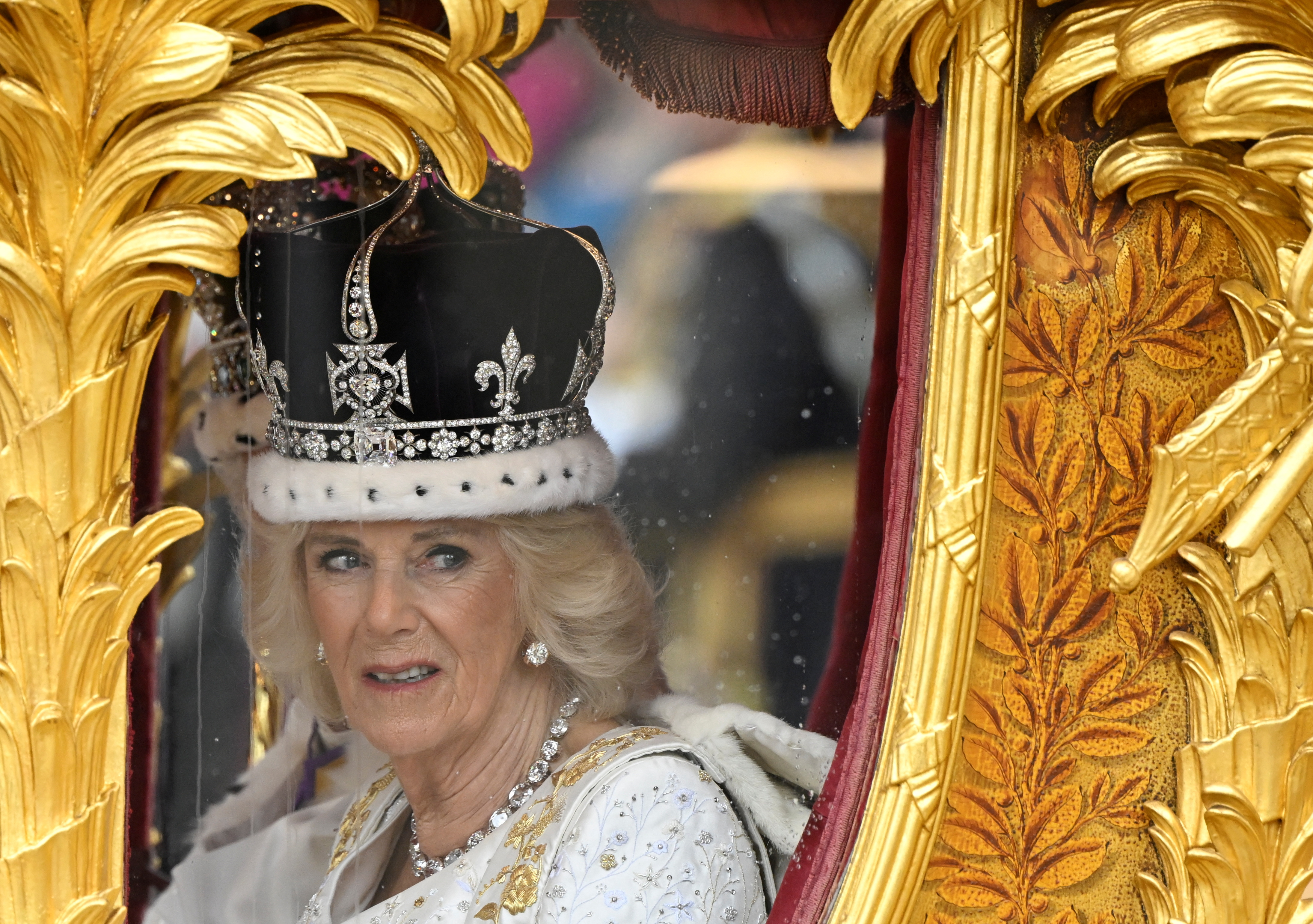 Britain's King Charles and Queen Camilla leave Westminster Abbey following their coronation ceremony, in London, Britain May 6, 2023. REUTERS/Toby Melville/Pool
