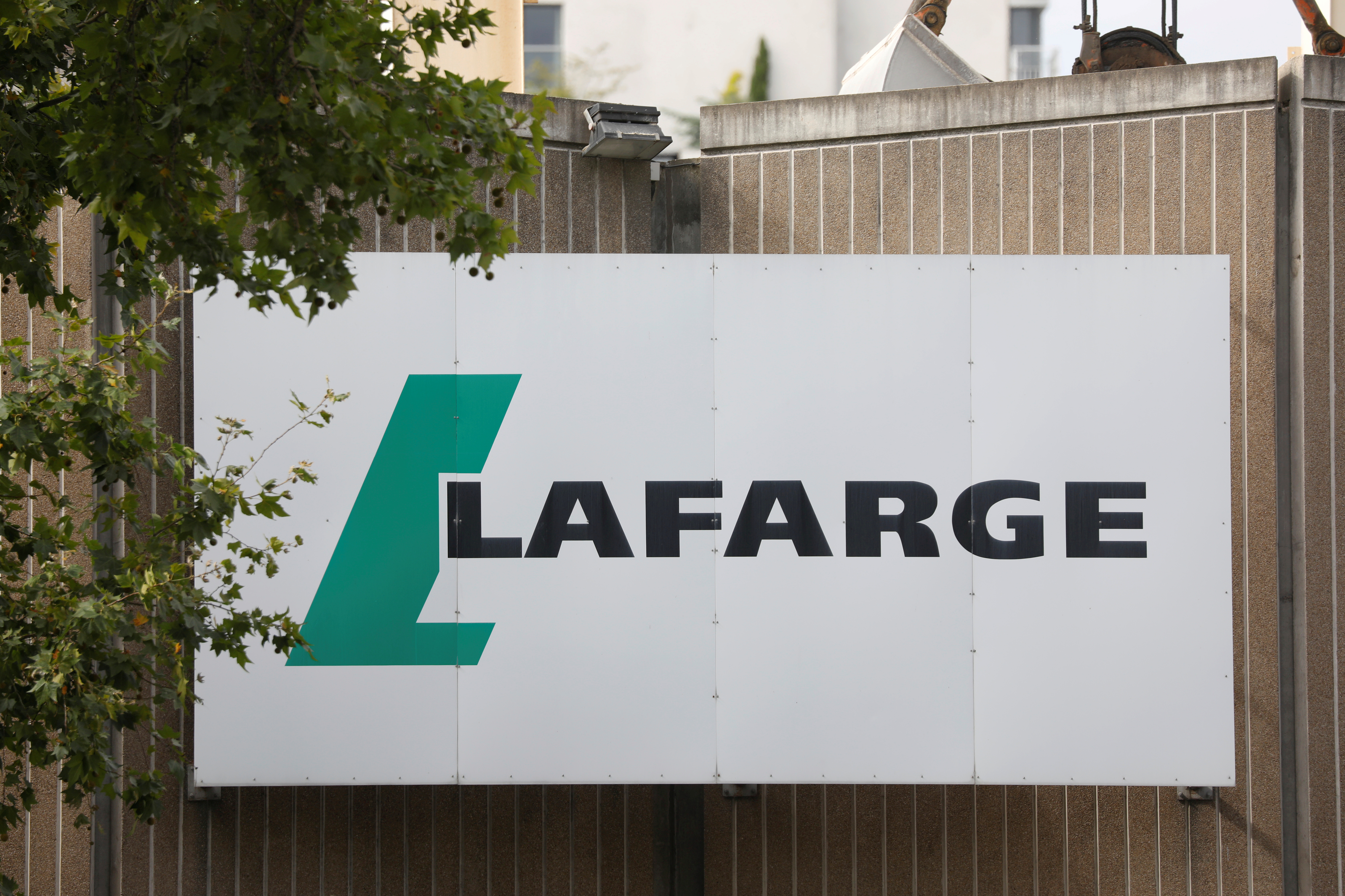 FILE PHOTO: The logo of French concrete maker Lafarge is seen on the plant of Bercy on the banks of the river Seine in Paris, France, September 3, 2020. REUTERS/Charles Platiau/File Photo