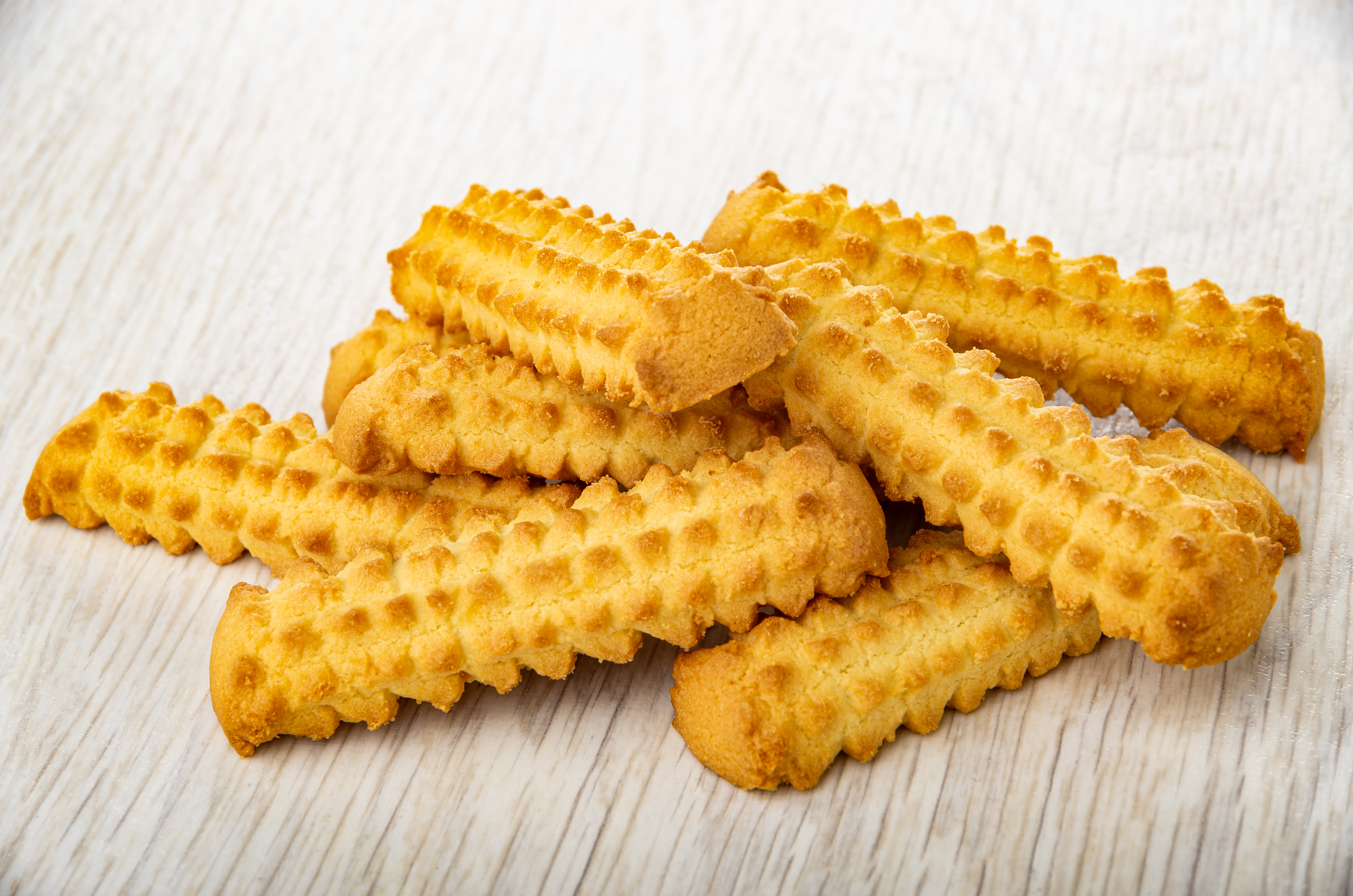 29.6.21. (a) Domaci keks, stock-photo-heap-of-shortbread-cookies-in-shape-sticks-on-wooden-table-1957205842