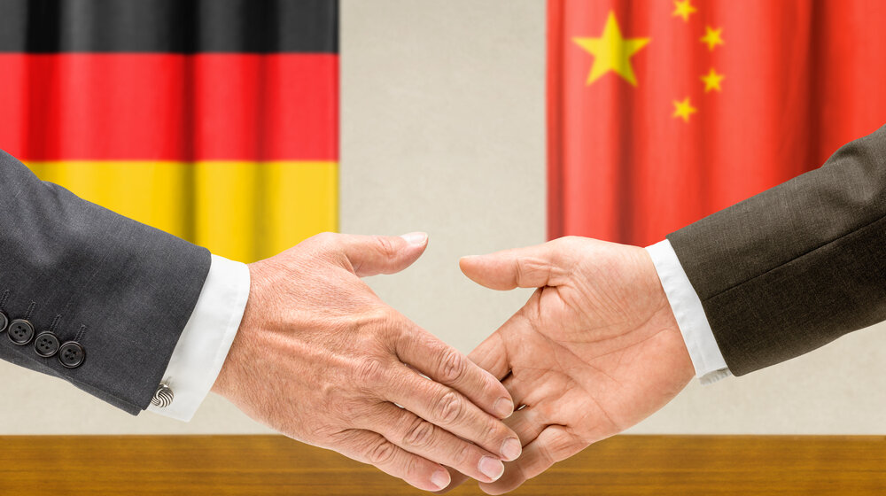 Representatives,Of,Germany,And,China,Shake,Hands