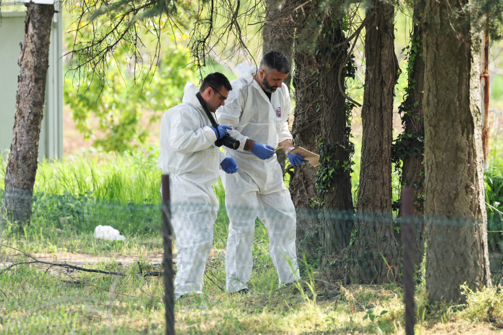Members of the forensic team inspect the crime scene, in the aftermath of a shooting in Malo Orasje, Serbia, May 5, 2023. REUTERS/Antonio Bronic