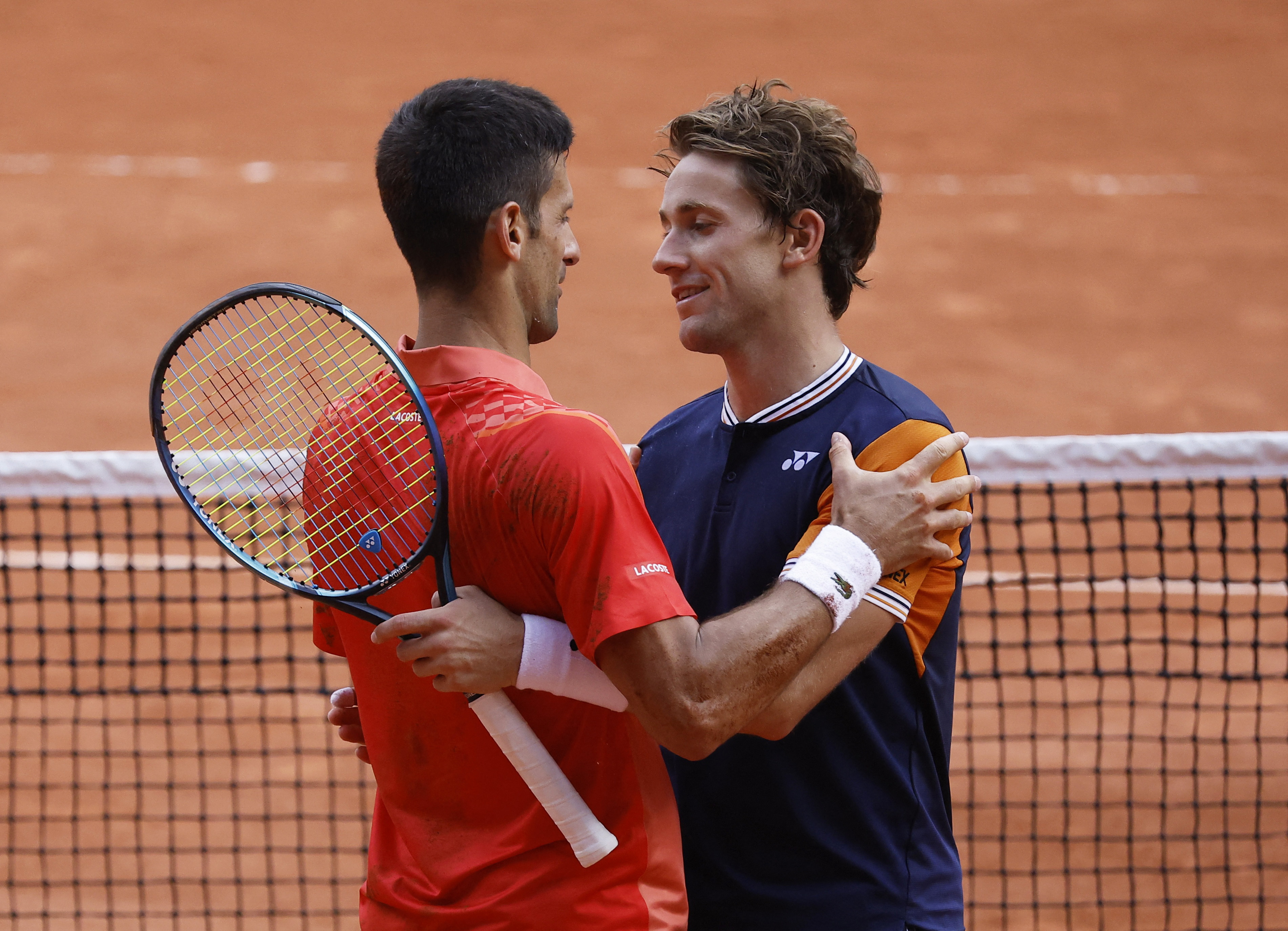 Tennis - French Open - Roland Garros, Paris, France - June 11, 2023 Serbia's Novak Djokovic celebrates with Norway's Casper Ruud after winning the final REUTERS/Christian Hartmann