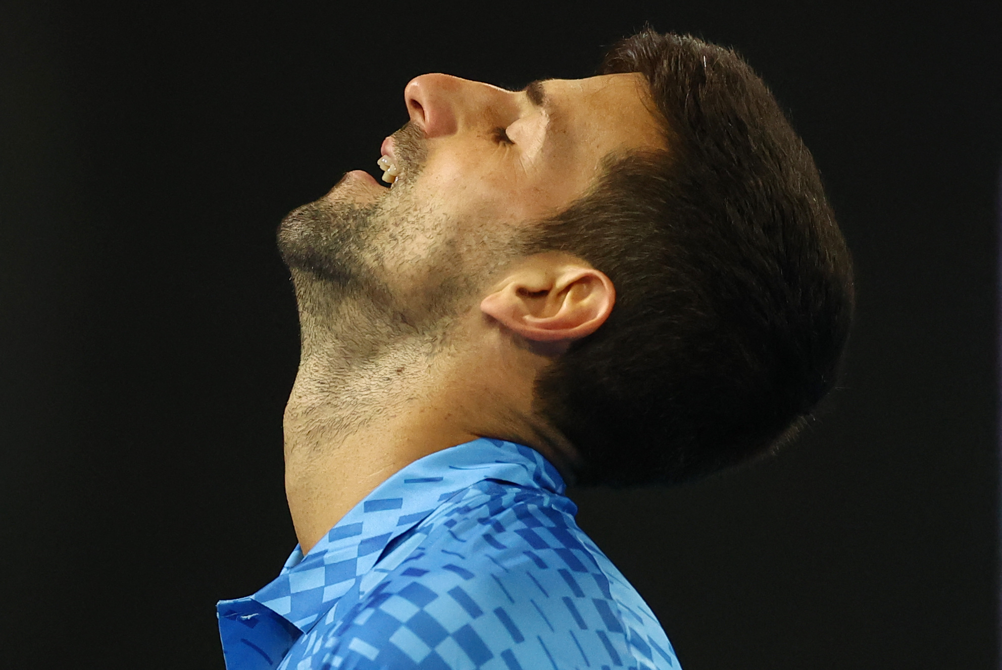 Tennis - Australian Open - Melbourne Park, Melbourne, Australia - January 19, 2023 Serbia's Novak Djokovic reacts during his second round match against France's Enzo Couacaud REUTERS/Carl Recine
