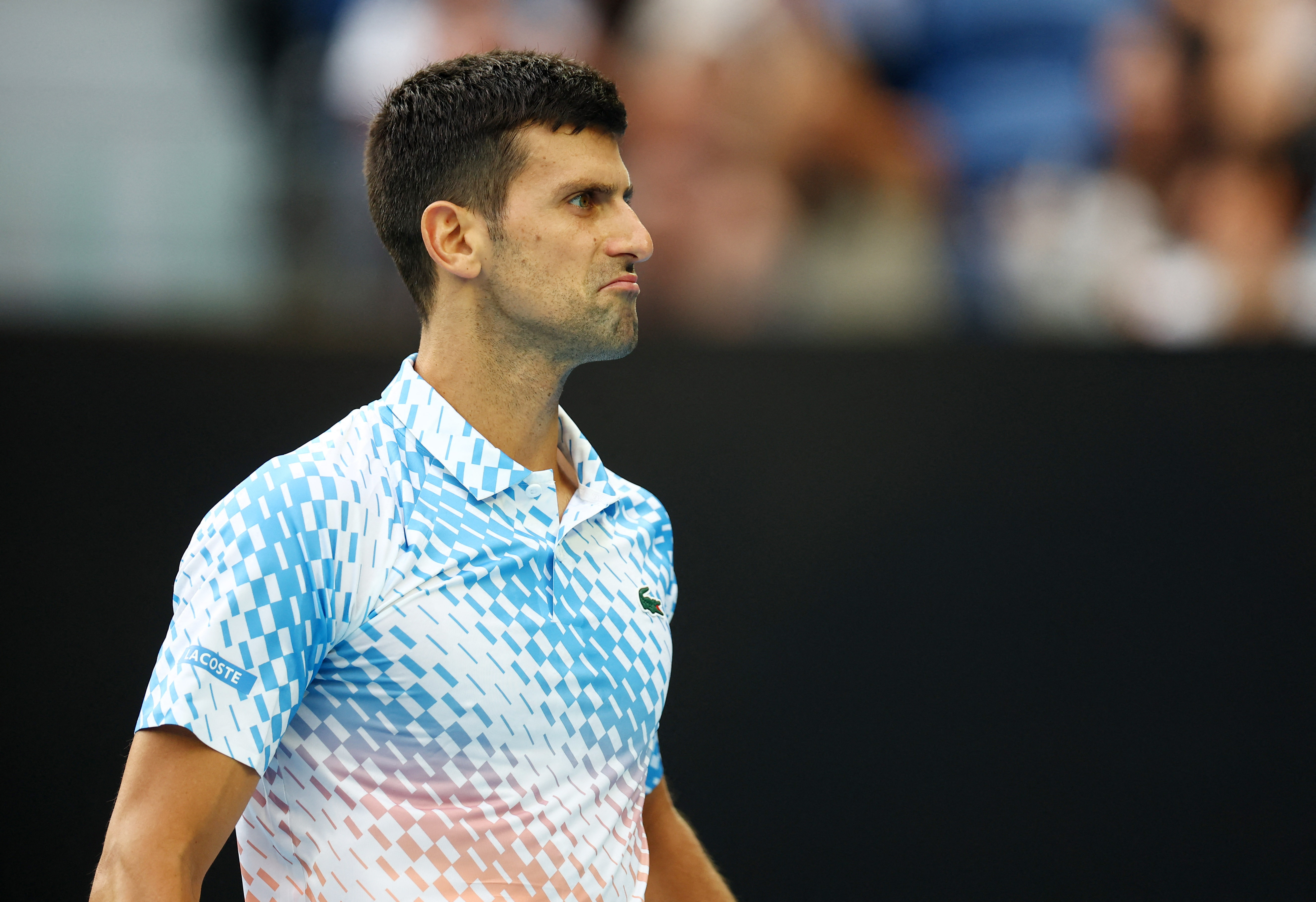 Tennis - Australian Open - Melbourne Park, Melbourne, Australia - January 21, 2023 Serbia's Novak Djokovic reacts during his third round match against Bulgaria's Grigor Dimitrov REUTERS/Hannah Mckay