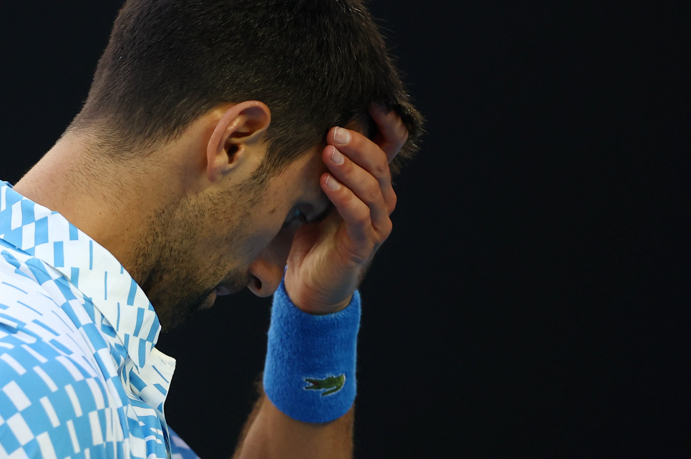 Tennis - Australian Open - Melbourne Park, Melbourne, Australia - January 25, 2023 Serbia’s Novak Djokovic reacts during his quarter final match against Russia’s Andrey Rublev REUTERS/Hannah Mckay
