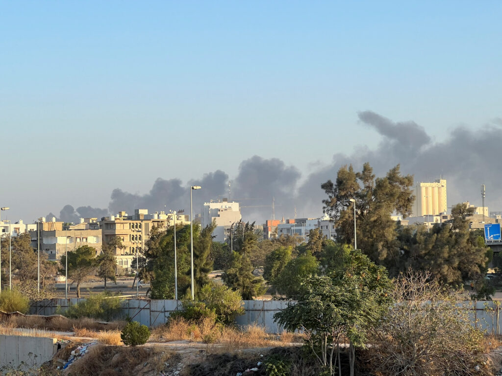 Smoke rises amid clashes between armed factions, in Tripoli, Libya August 15, 2023. REUTERS/Ayman al-Sahili