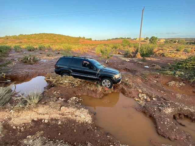 A view shows a car stuck on a damaged road, after a powerful storm and heavy rainfall hit Qandula, Libya, September 12, 2023. REUTERS/Esam Omran Al-Fetori
