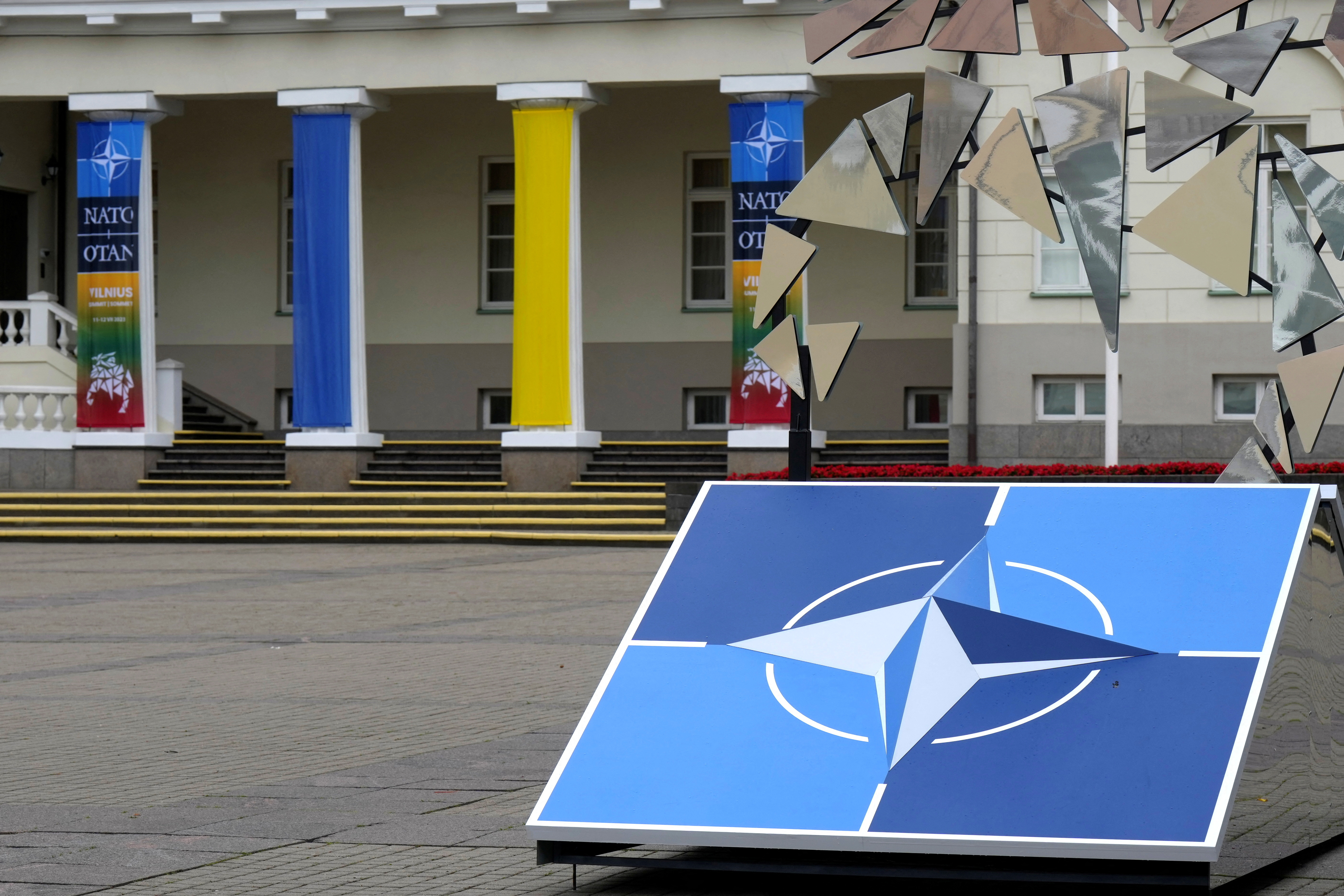 A NATO sign is seen next to the Presidential Palace in Vilnius, Lithuania July 10, 2023. REUTERS/Ints Kalnins