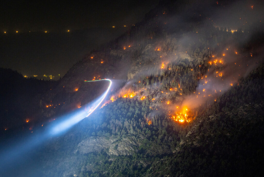 General view of a wildfire on the flank of a mountain in Bitsch near Brig, Switzerland, July 18, 2023. Picture taken with a long exposure. REUTERS/Denis Balibouse     TPX IMAGES OF THE DAY