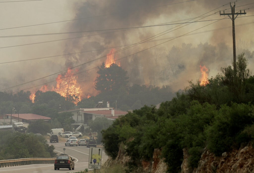 A wildfire burns near the village of Agios Sotira, west of Athens, Greece, July 20, 2023. REUTERS/Fedja Grulovic