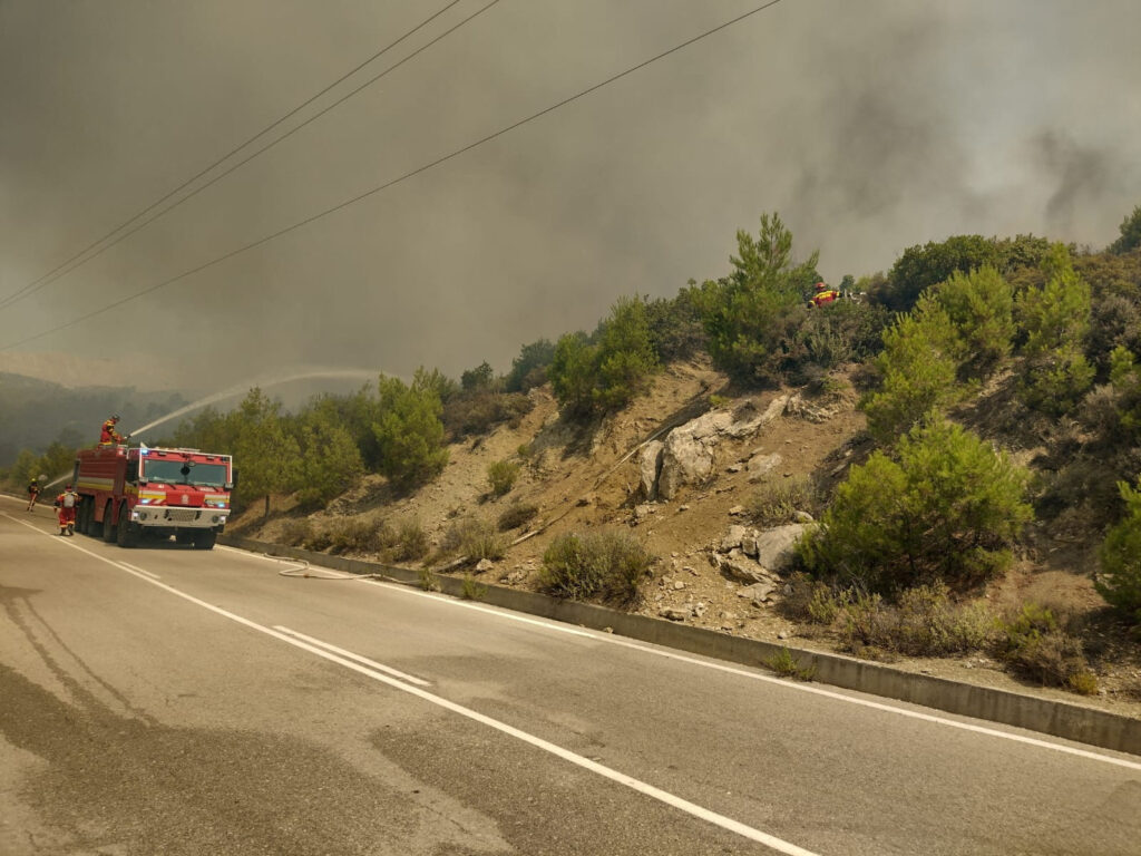 Firefighters try to extinguish a wildfire burning near Alaerma, Rhodes Island, Greece, July 22, 2023. HAZZ Slovak Fire and Rescue Services/Handout via REUTERS    THIS IMAGE HAS BEEN SUPPLIED BY A THIRD PARTY. MANDATORY CREDIT. NO RESALES. NO ARCHIVES.
