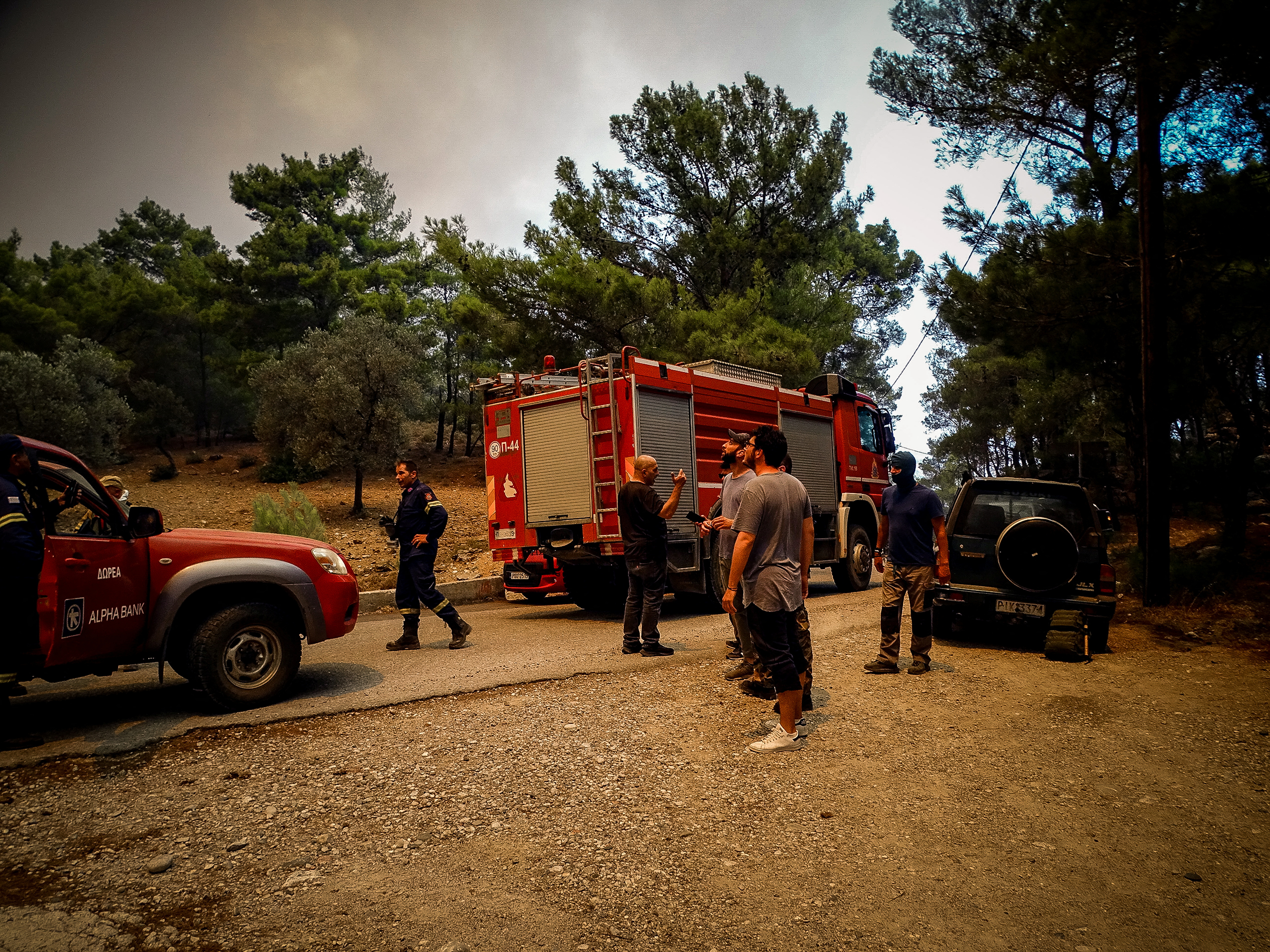 Firefighters are seen near a wildfire on the island of Rhodes, Greece, July 22, 2023. Argiris Mantikos/Eurokinissi via REUTERS ATTENTION EDITORS - THIS IMAGE HAS BEEN SUPPLIED BY A THIRD PARTY. NO RESALES. NO ARCHIVES. NO EDITORIAL SALES IN GREECE