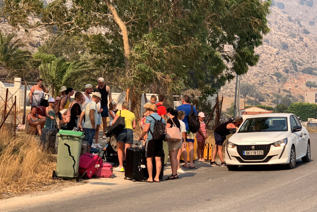 Tourists are being evacuated as wildfire burns near Lindos, on the island of Rhodes, Greece, July 22, 2023. REUTERS/Lefteris Diamandis  NO RESALES. NO ARCHIVES