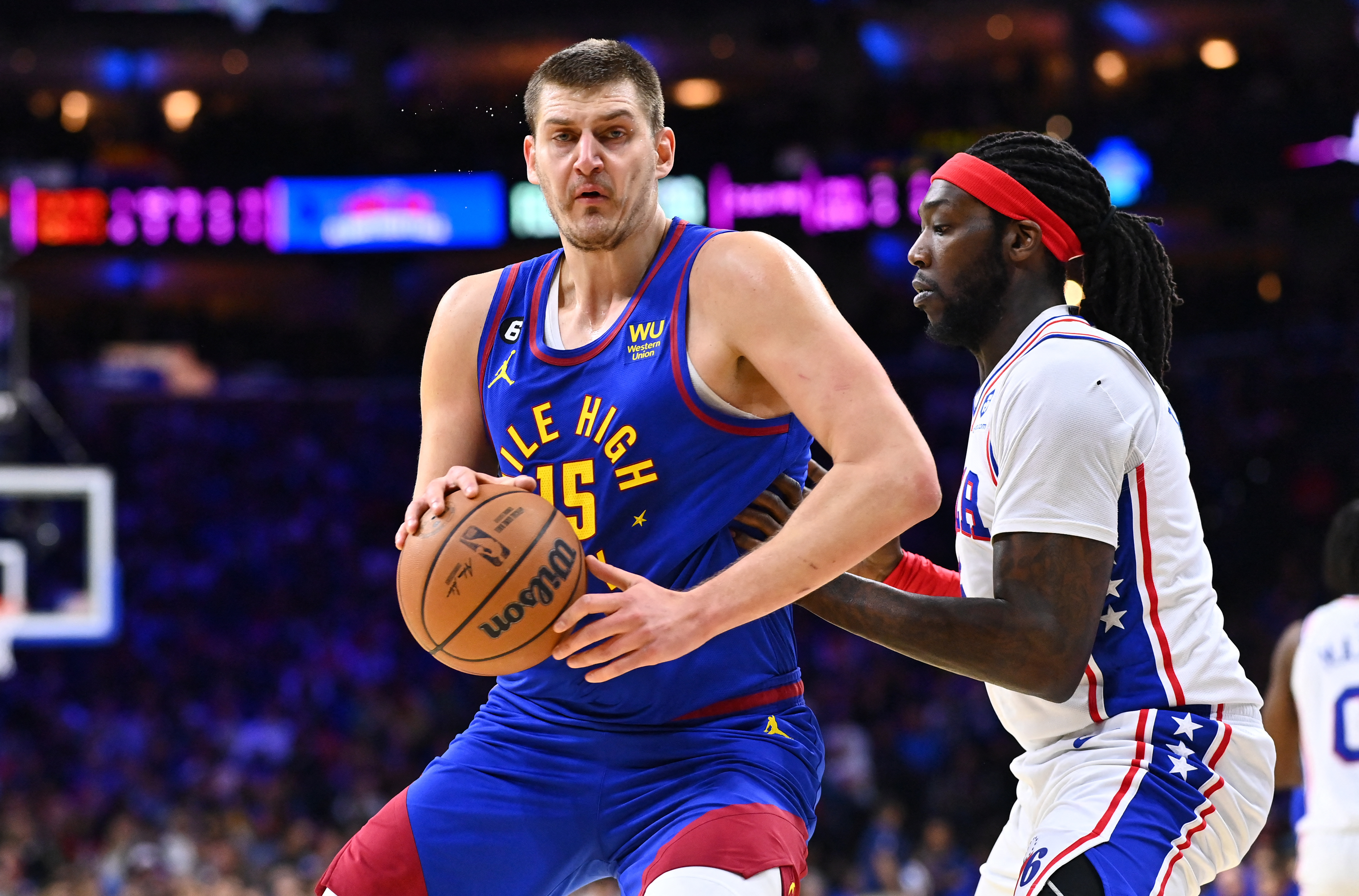 Jan 28, 2023; Philadelphia, Pennsylvania, USA; Denver Nuggets center Nikola Jokic (15) controls the ball against Philadelphia 76ers center Montrezl Harrell (5) in the first quarter at Wells Fargo Center. Mandatory Credit: Kyle Ross-USA TODAY Sports