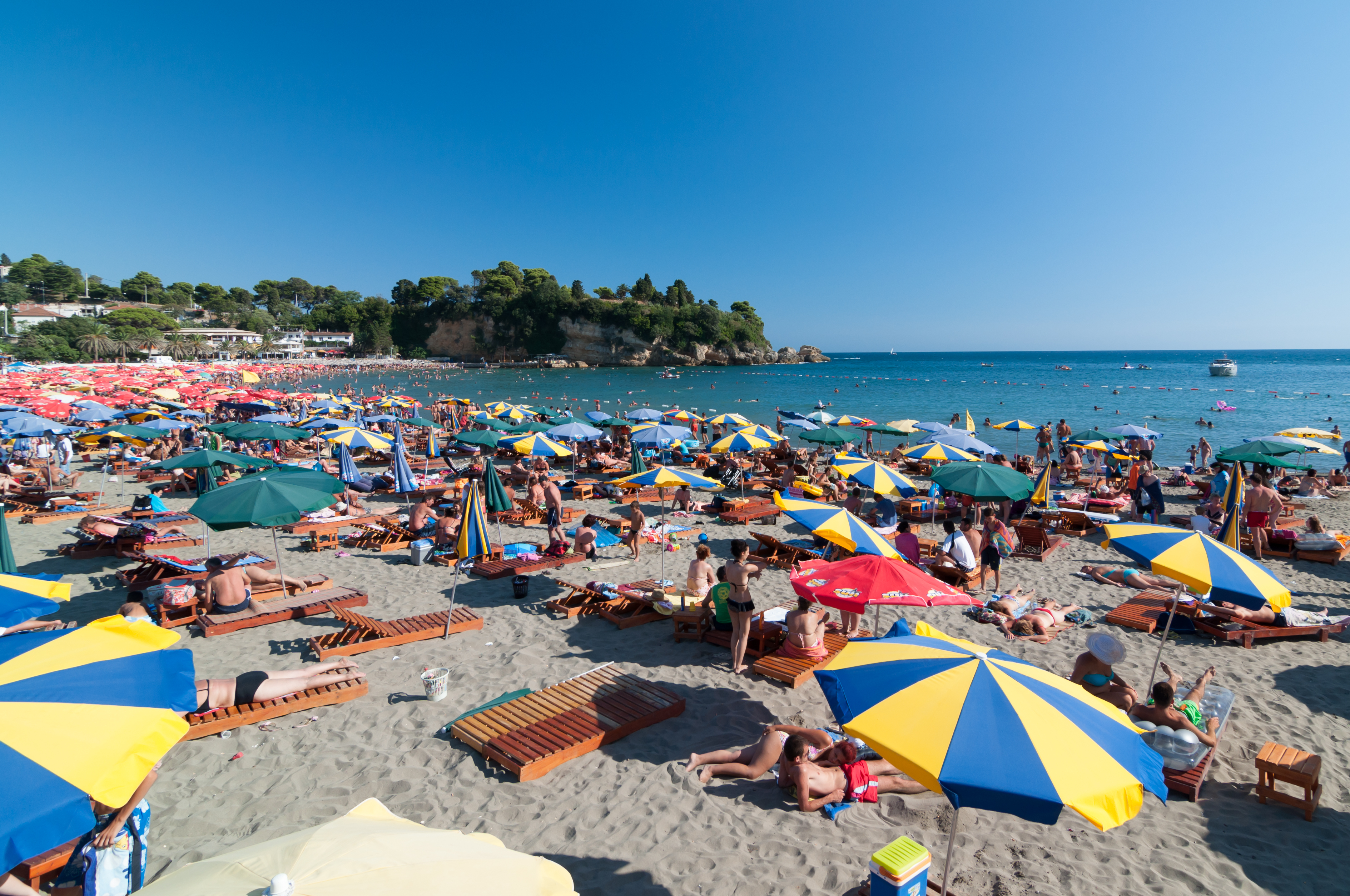 Ulcinj,,Montenegro,-,August,10,,2011:,Colorful,Sun,Umbrellas,On