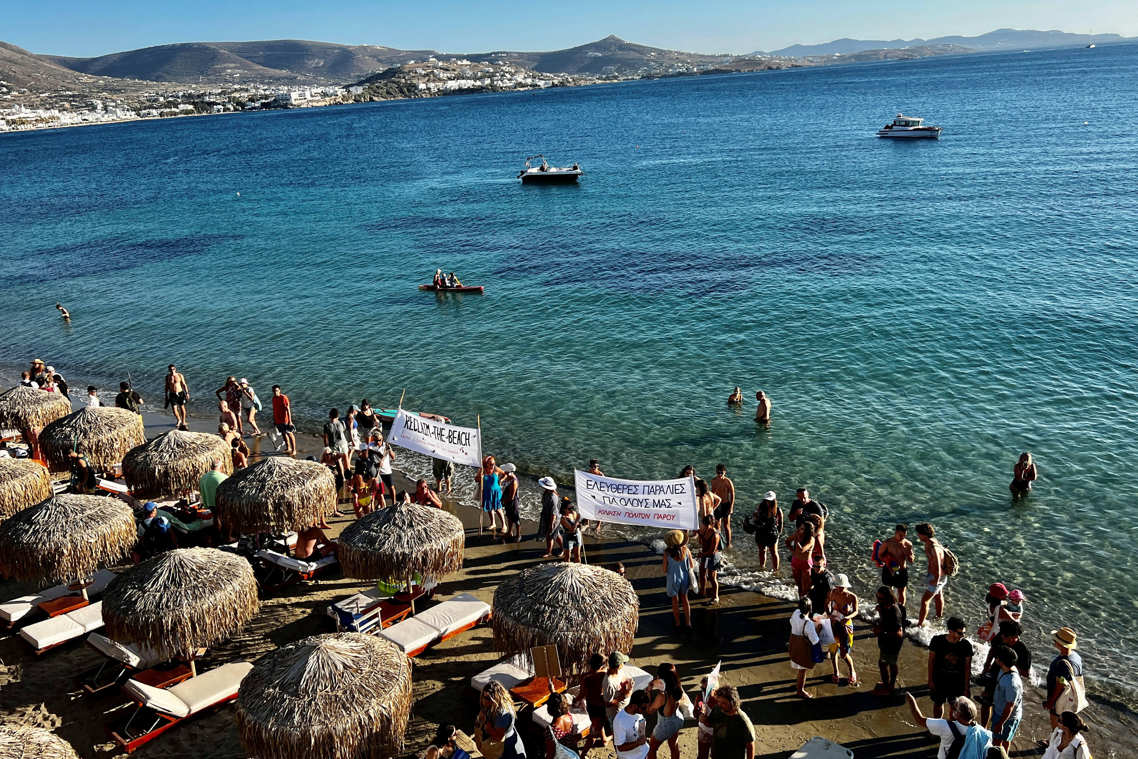 Protesters stage demonstration for free access to beaches on Marcello and Krios beaches, in Paros island, Greece, July 30, 2023. REUTERS/Ronit Nesher
