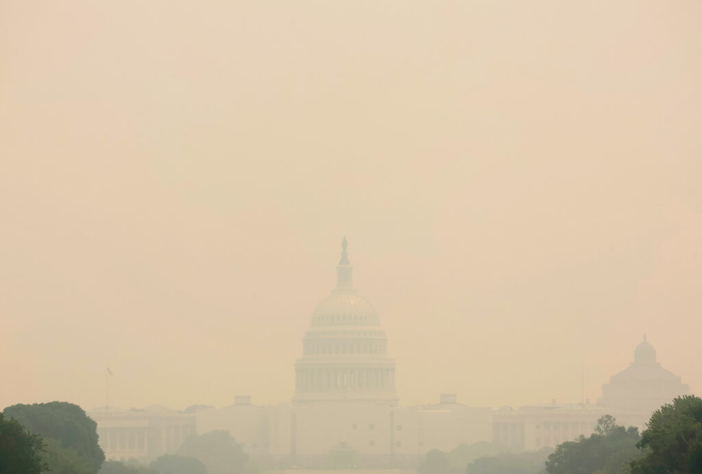 The U.S. Capitol building is seen shrouded in haze and smoke caused by wildfires in Canada, in this view from the National Mall in Washington, U.S., June 8, 2023.  REUTERS/Leah Millis