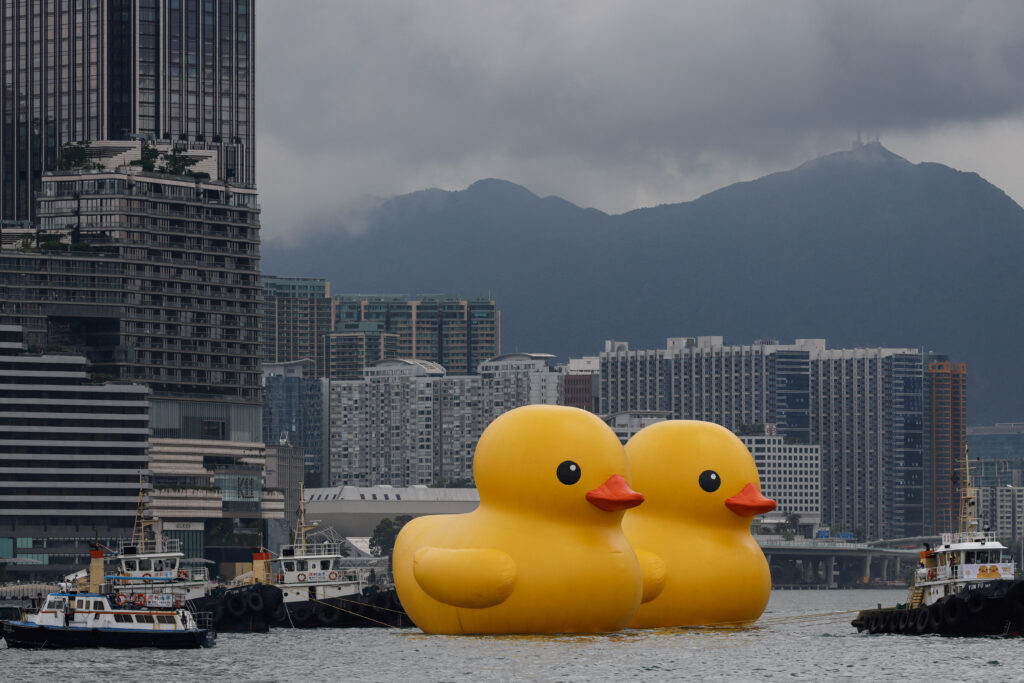 An art installation dubbed "Double Ducks" by Dutch artist Florentijn Hofman, is seen at Victoria Harbour, in Hong Kong, China June 9, 2023. REUTERS/Tyrone Siu