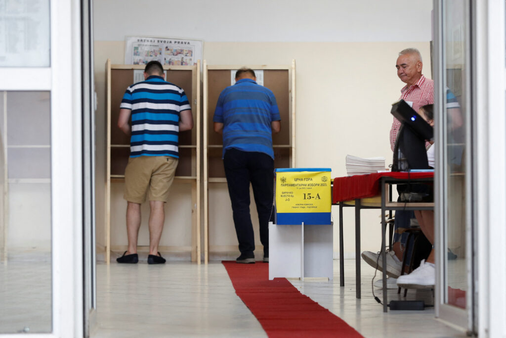 People cast their vote at a polling station during snap parliamentary elections in Podgorica, Montenegro, June 11, 2023. REUTERS/Stevo Vasiljevic