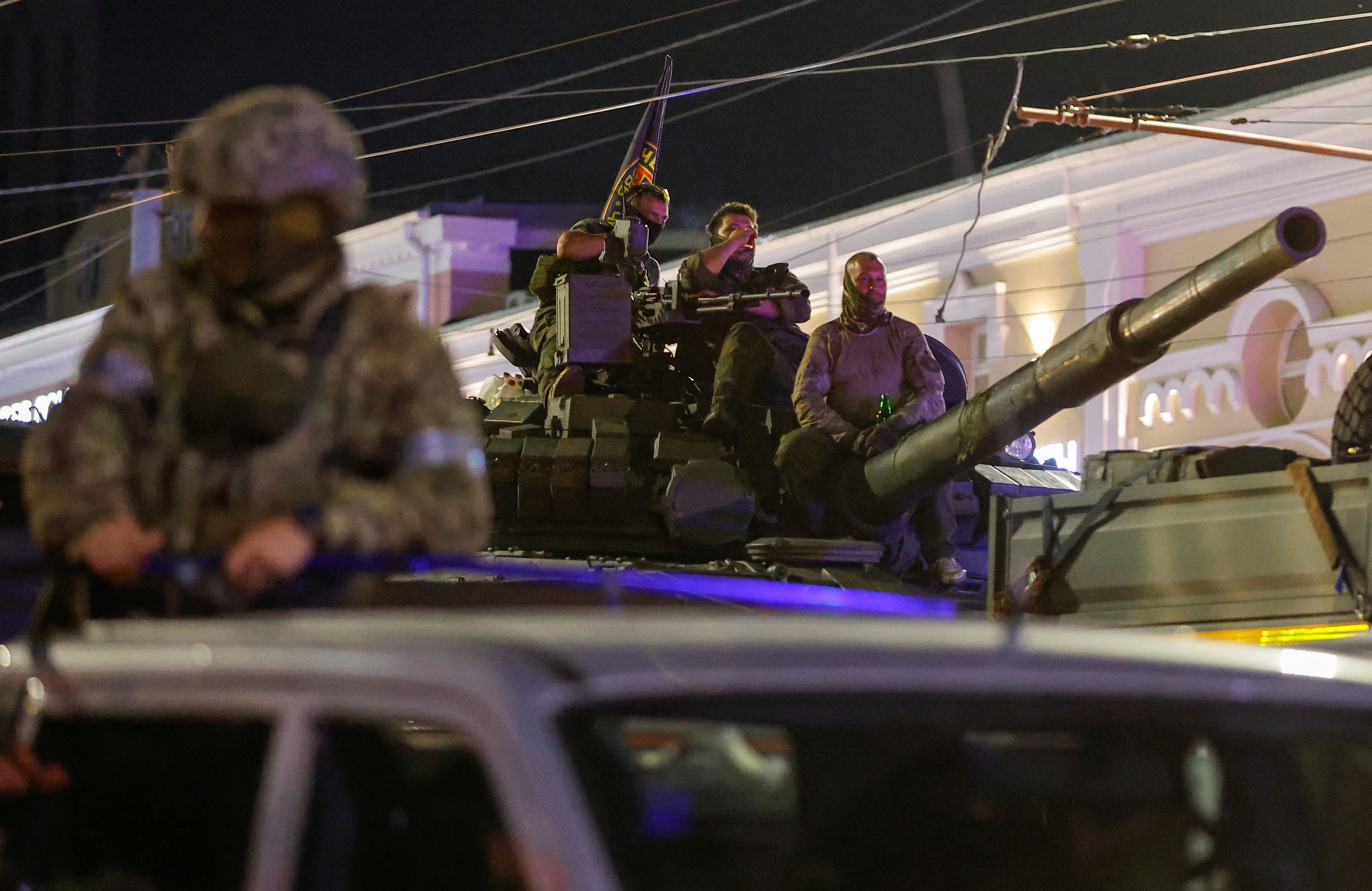 Fighters of Wagner private mercenary group pull out of the headquarters of the Southern Military District to return to base, in the city of Rostov-on-Don, Russia, June 24, 2023. REUTERS/Alexander Ermochenko