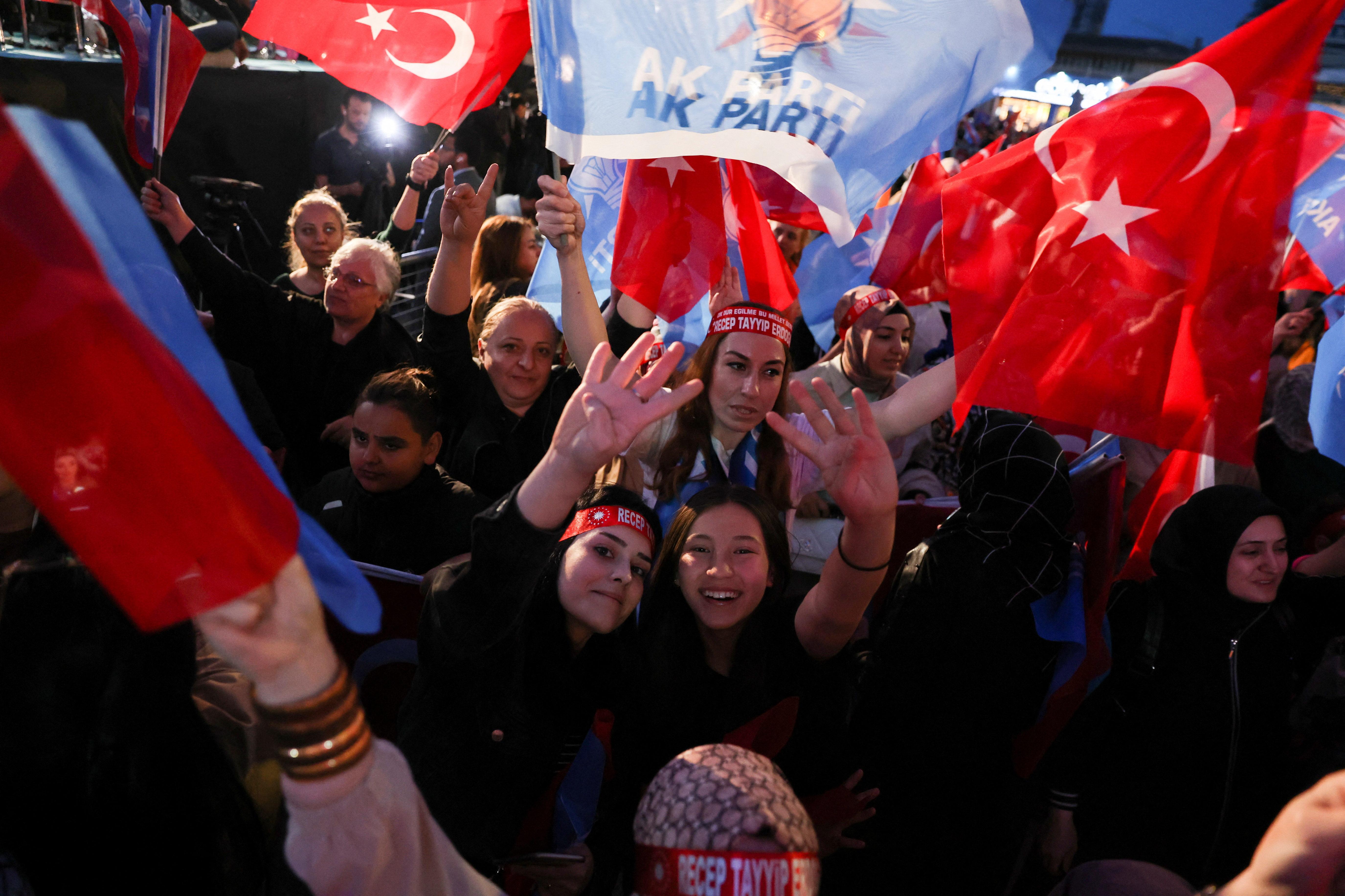 Supporters of Turkish President Recep Tayyip Erdogan and AK Party (AKP) react after early exit polls at the AK Party headquarters in Ankara, Turkey May 14, 2023. REUTERS/Umit Bektas