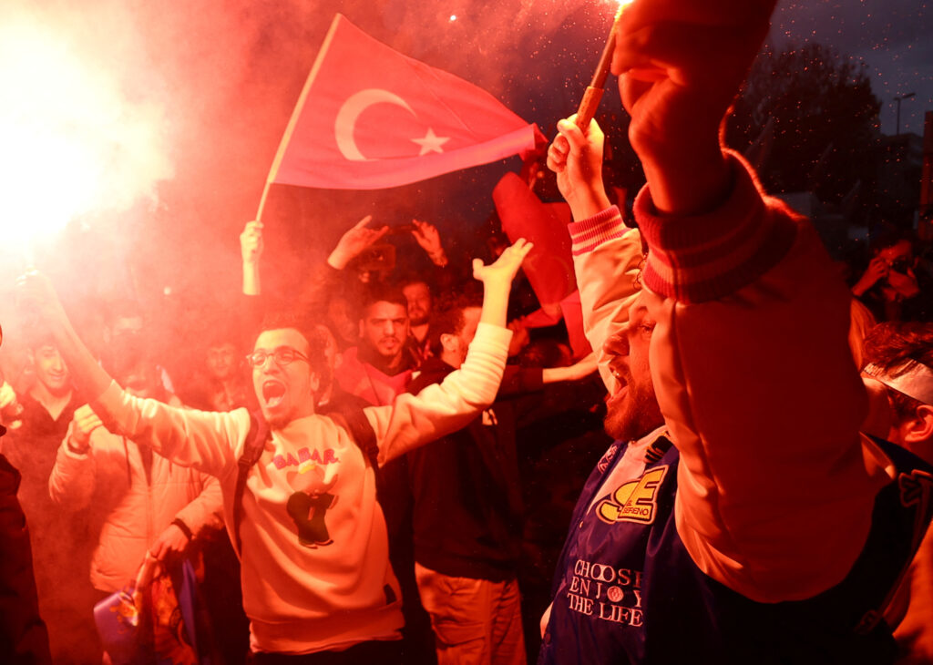 Supporters of Turkish President Tayyip Erdogan react following early exit poll results for the second round of the presidential election outside the provincial headquarters of AK Party (AKP) in Istanbul, Turkey May 28, 2023. REUTERS/Hannah McKay