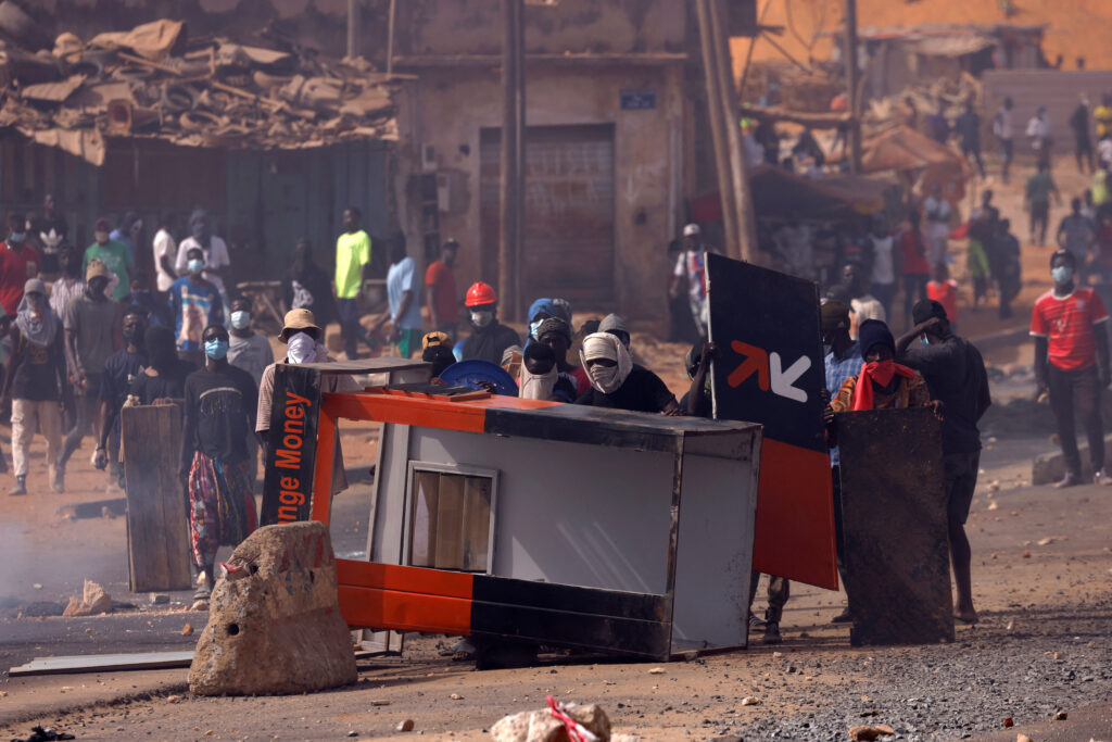 Supporters of Senegal opposition leader Ousmane Sonko stand behind barricades as they clash with security forces, after Sonko was sentenced to prison in Dakar, Senegal June 2, 2023. REUTERS/Zohra Bensemra