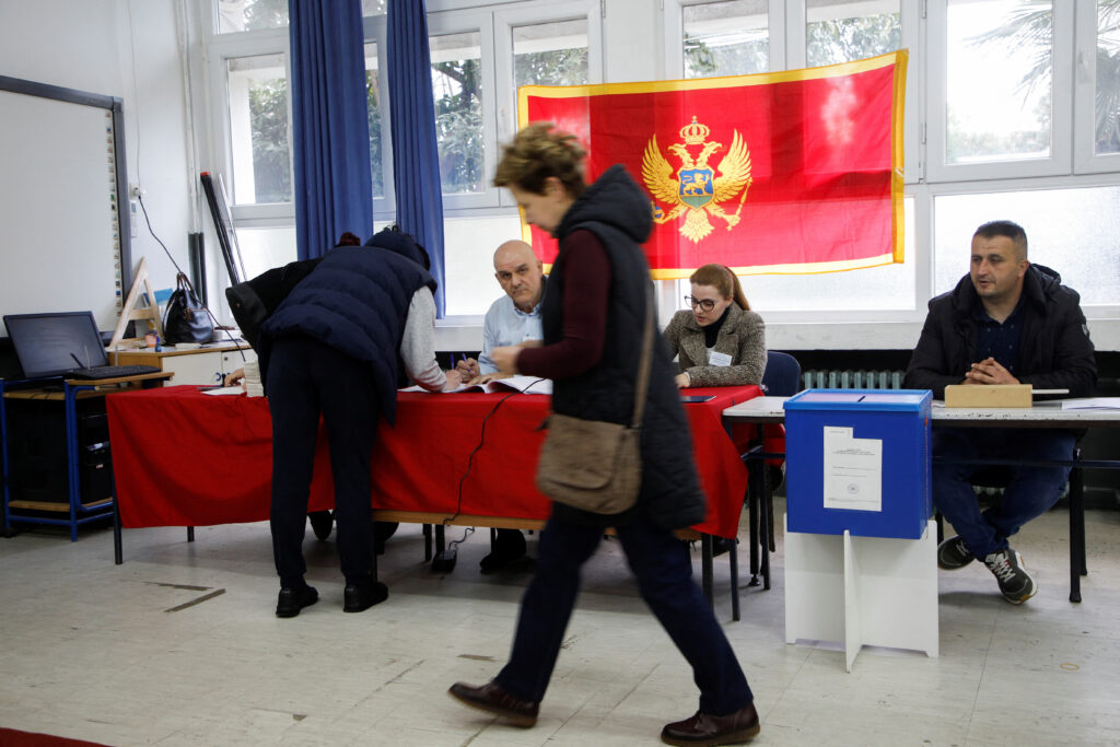 Officials work at a polling station during the run-off presidential election in Podgorica, Montenegro, April 2, 2023. REUTERS/Stevo Vasiljevic